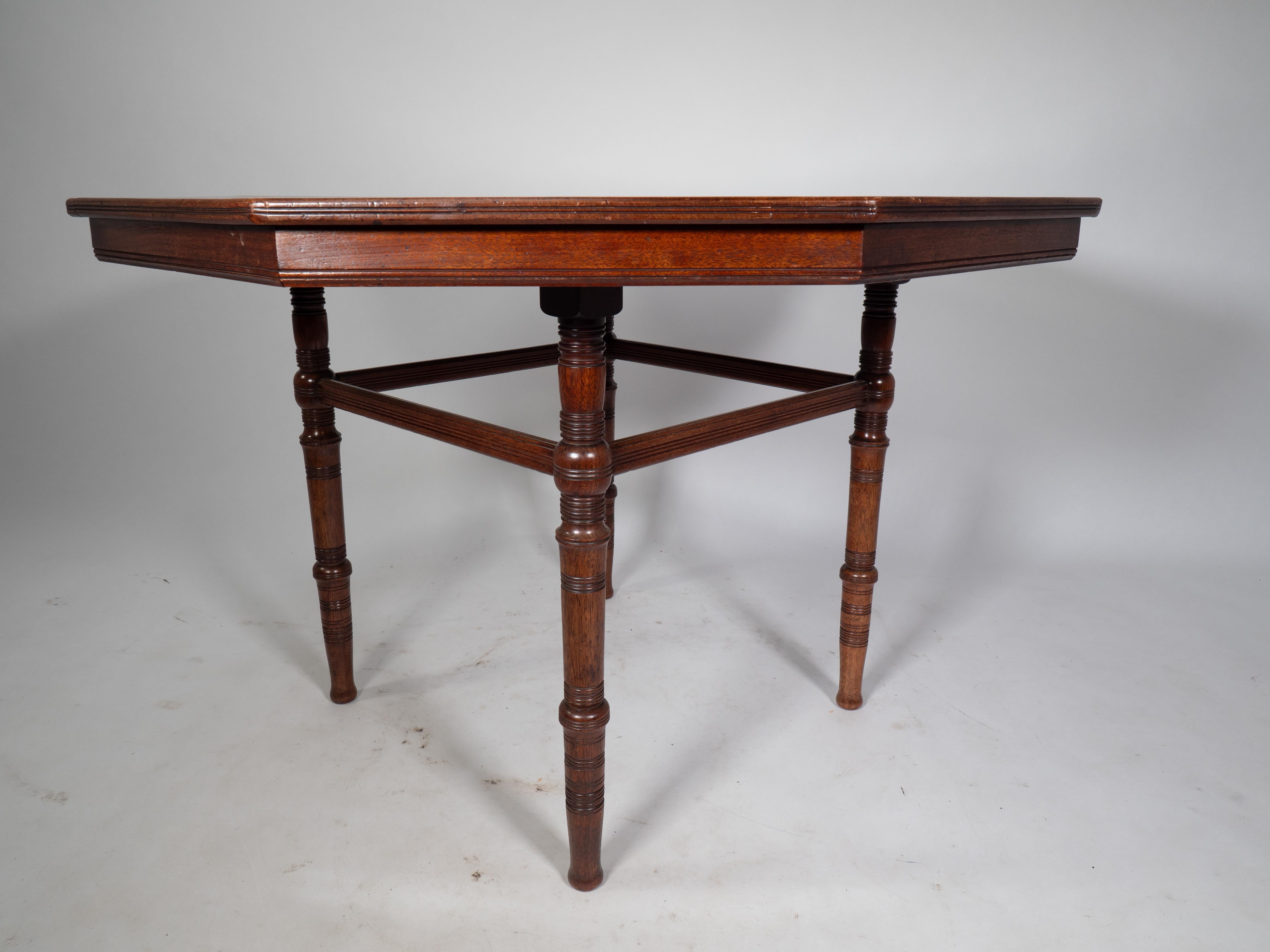 E W Godwin attributed. An Aesthetic Movement Walnut octagonal centre table For Sale 3