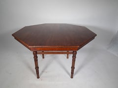E W Godwin attributed. An Aesthetic Movement Walnut octagonal centre table