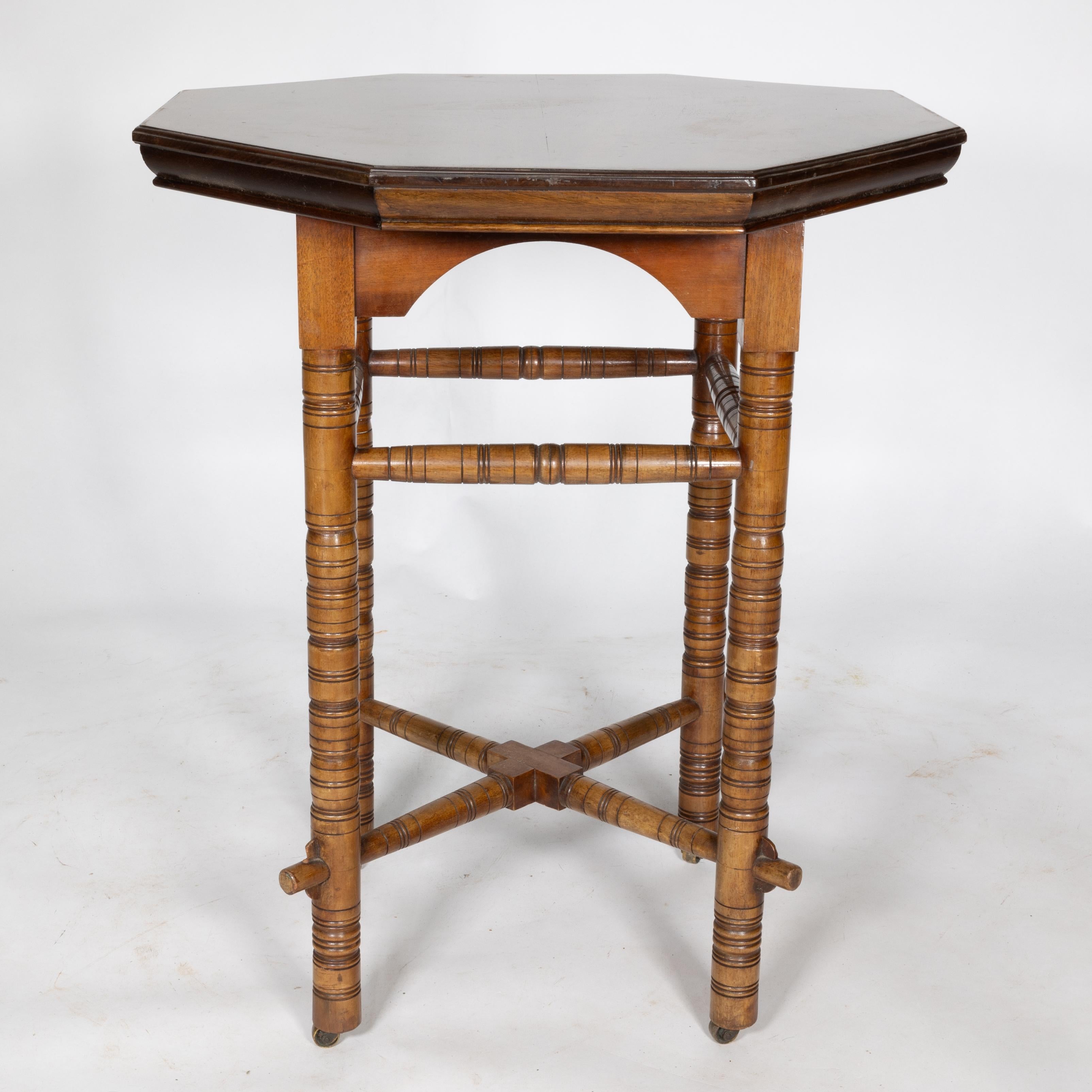 Late 19th Century E W Godwin (style of). An Aesthetic Movement walnut octagonal table For Sale