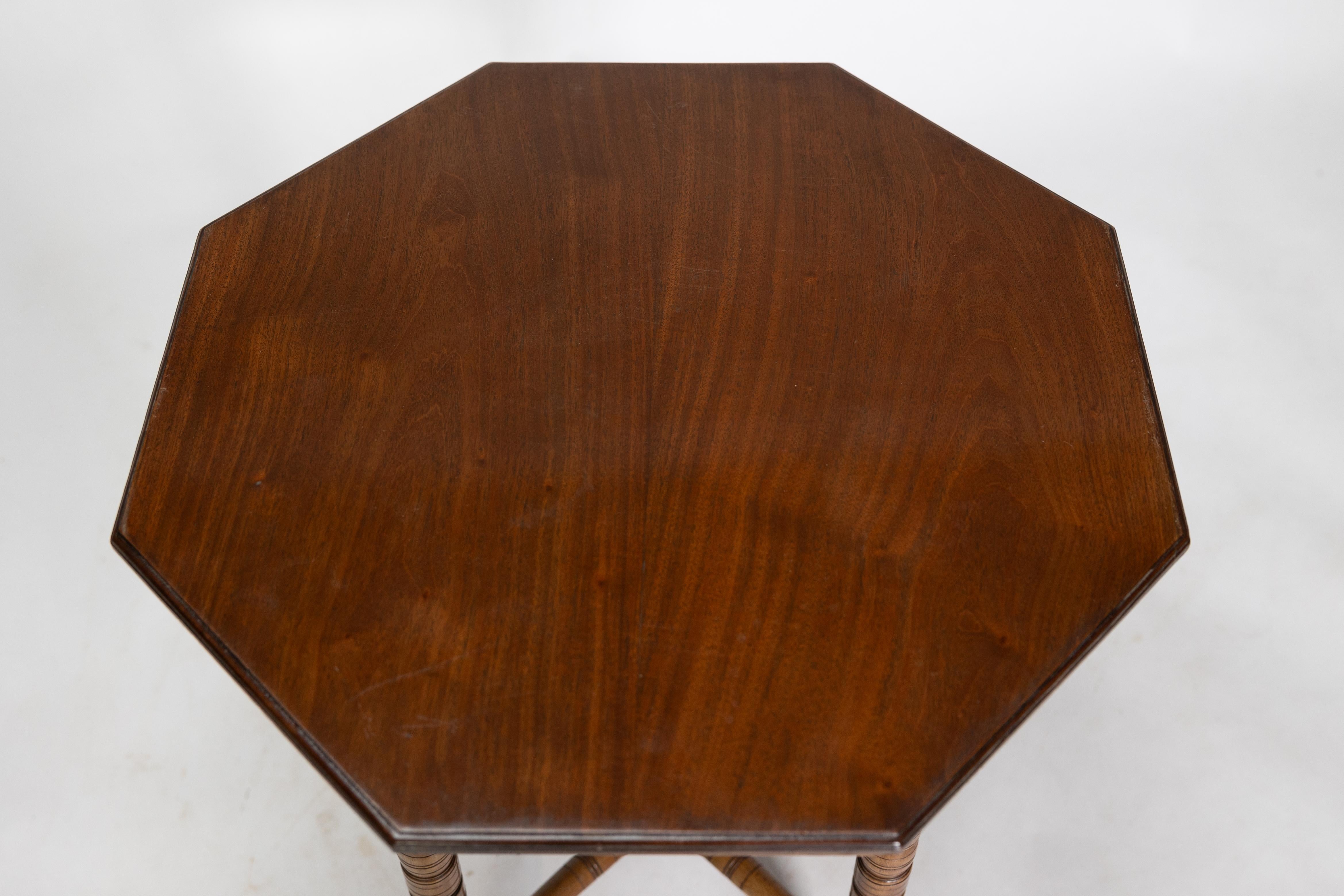 E W Godwin (style of). An Aesthetic Movement walnut octagonal table For Sale 1