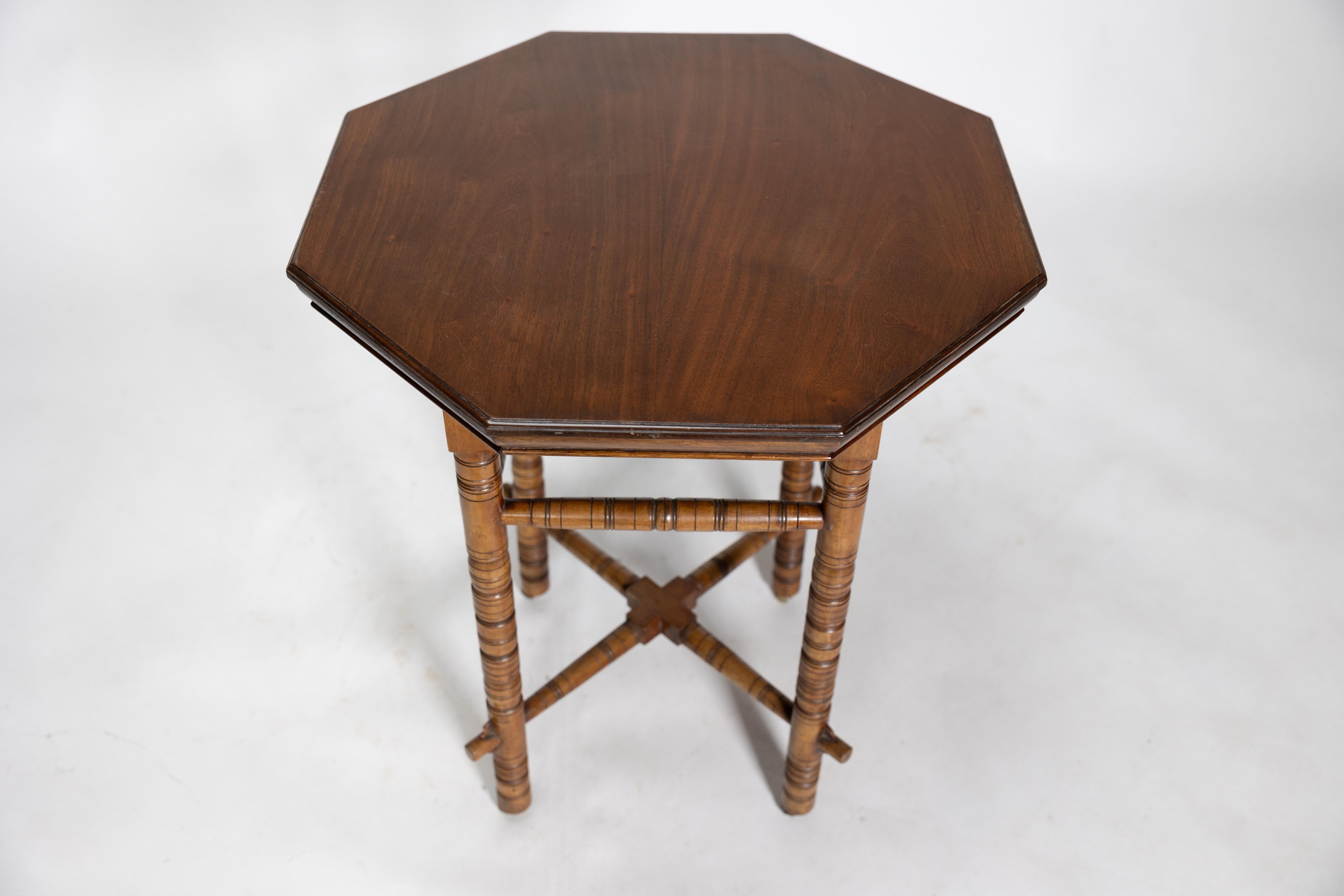E W Godwin (style of). An Aesthetic Movement walnut octagonal table For Sale 2