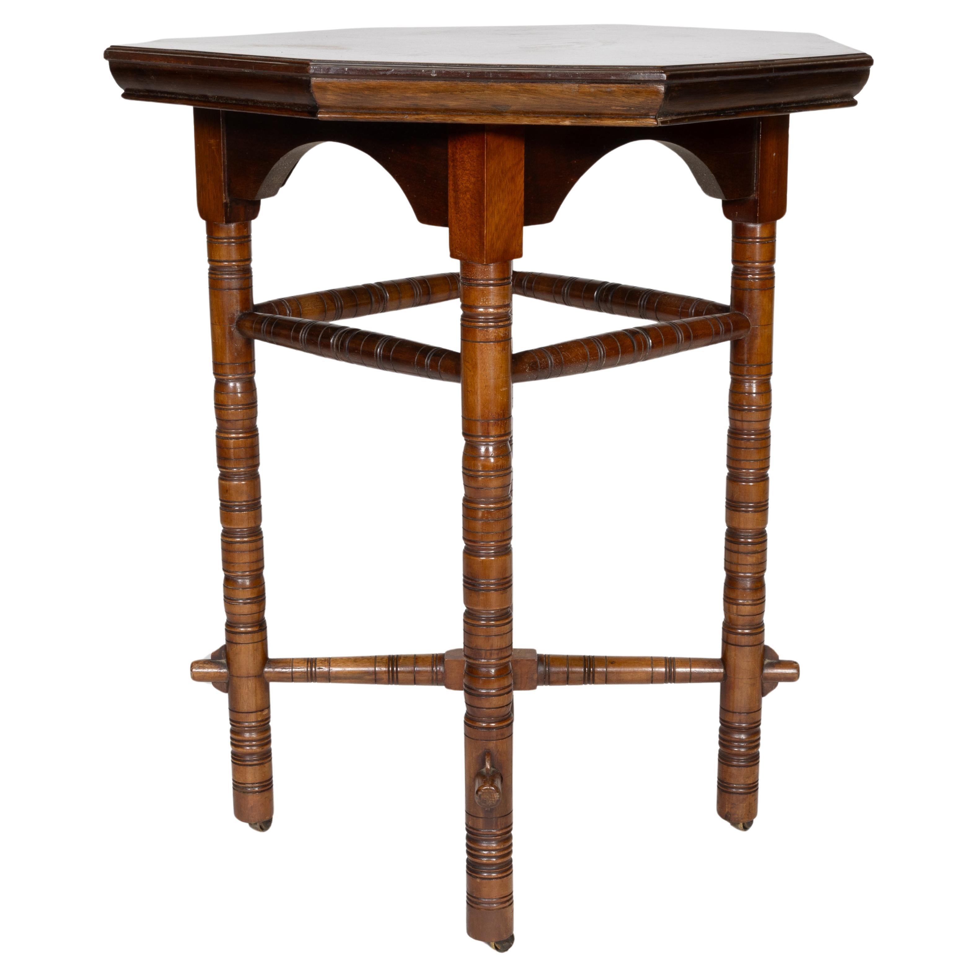 E W Godwin (style of). An Aesthetic Movement walnut octagonal table