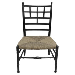 E W Godwin (style of). An Anglo-Japanese ebonized side chair