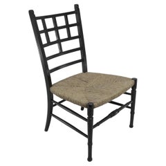 E W Godwin (estilo de). Una silla auxiliar anglo-japonesa ebonizada