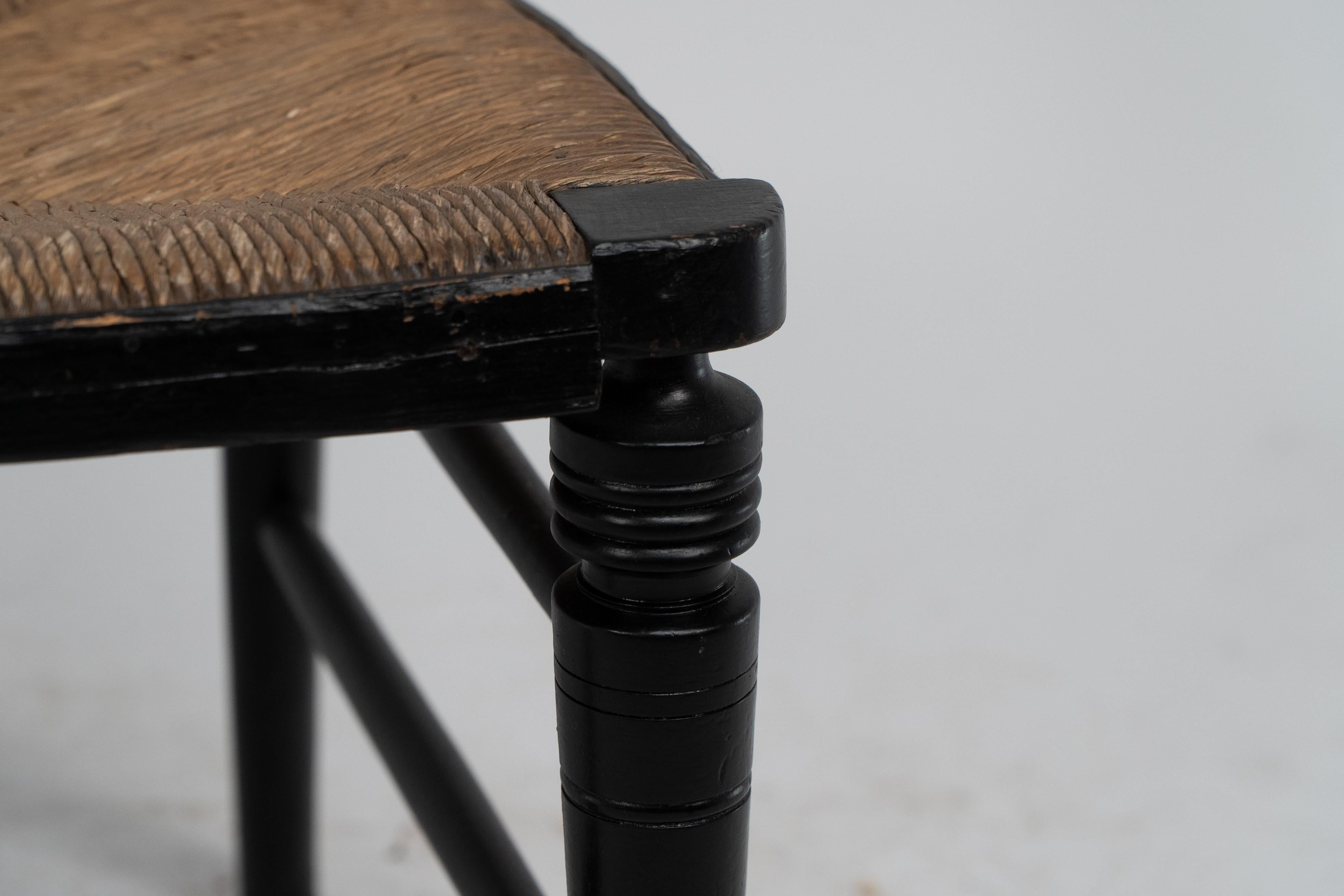 Walnut E W Godwin (style of). An Anglo-Japanese rush seat ebonized side chair For Sale