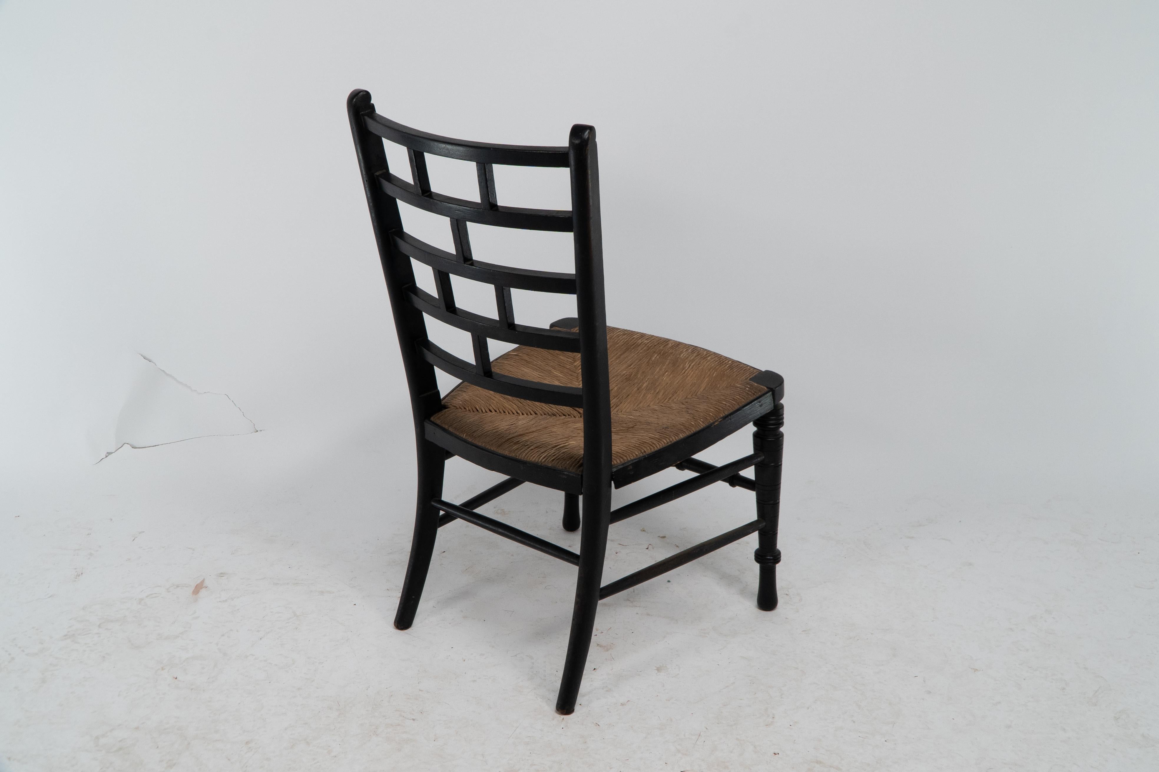 E W Godwin (style of). An Anglo-Japanese rush seat ebonized side chair For Sale 8