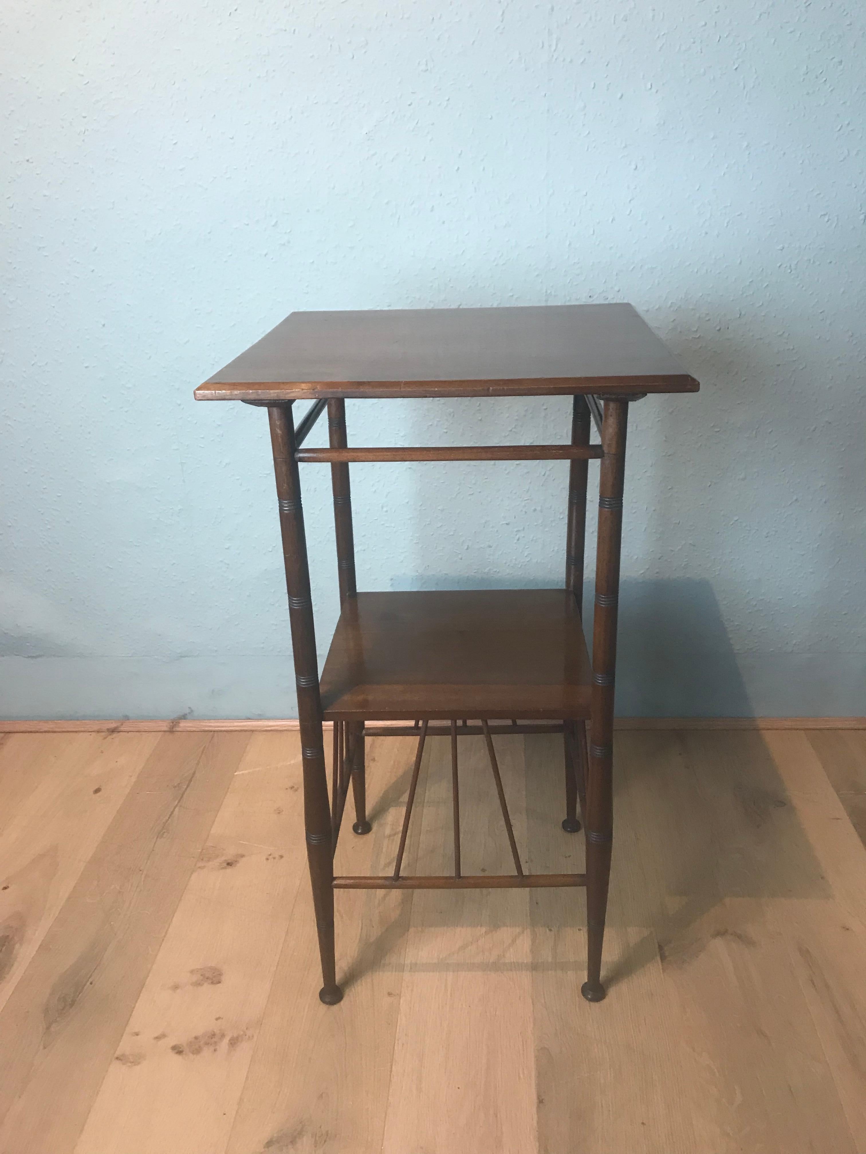 A very fine, delicate and slender E W Godwin style walnut side table, in the aesthetic movement circa 1890. This type of table was very popular during the late 19th century. The table is in very good condition, no loose joints with good patina, age