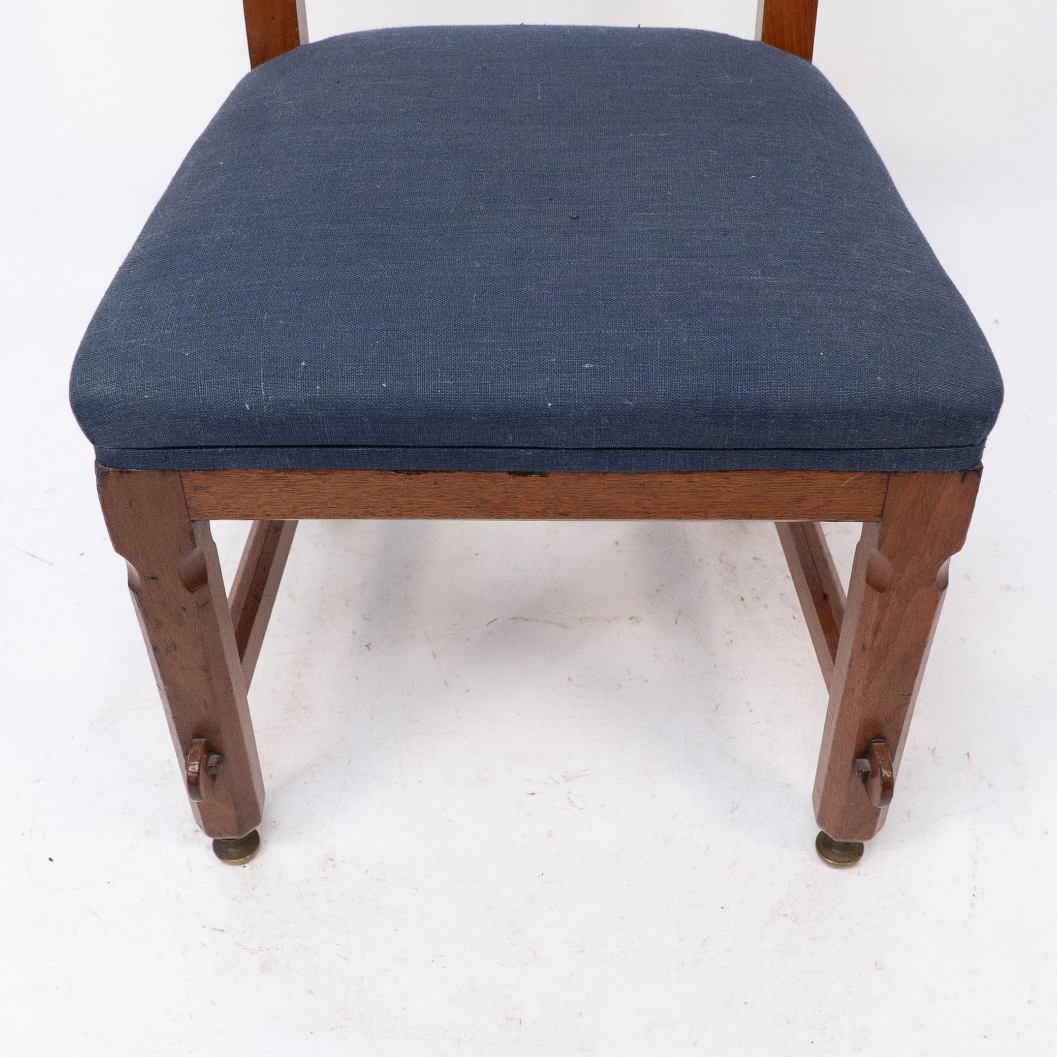 Late 19th Century E W Pugin. A walnut side chair with curvaceous back rest with oak pegs For Sale