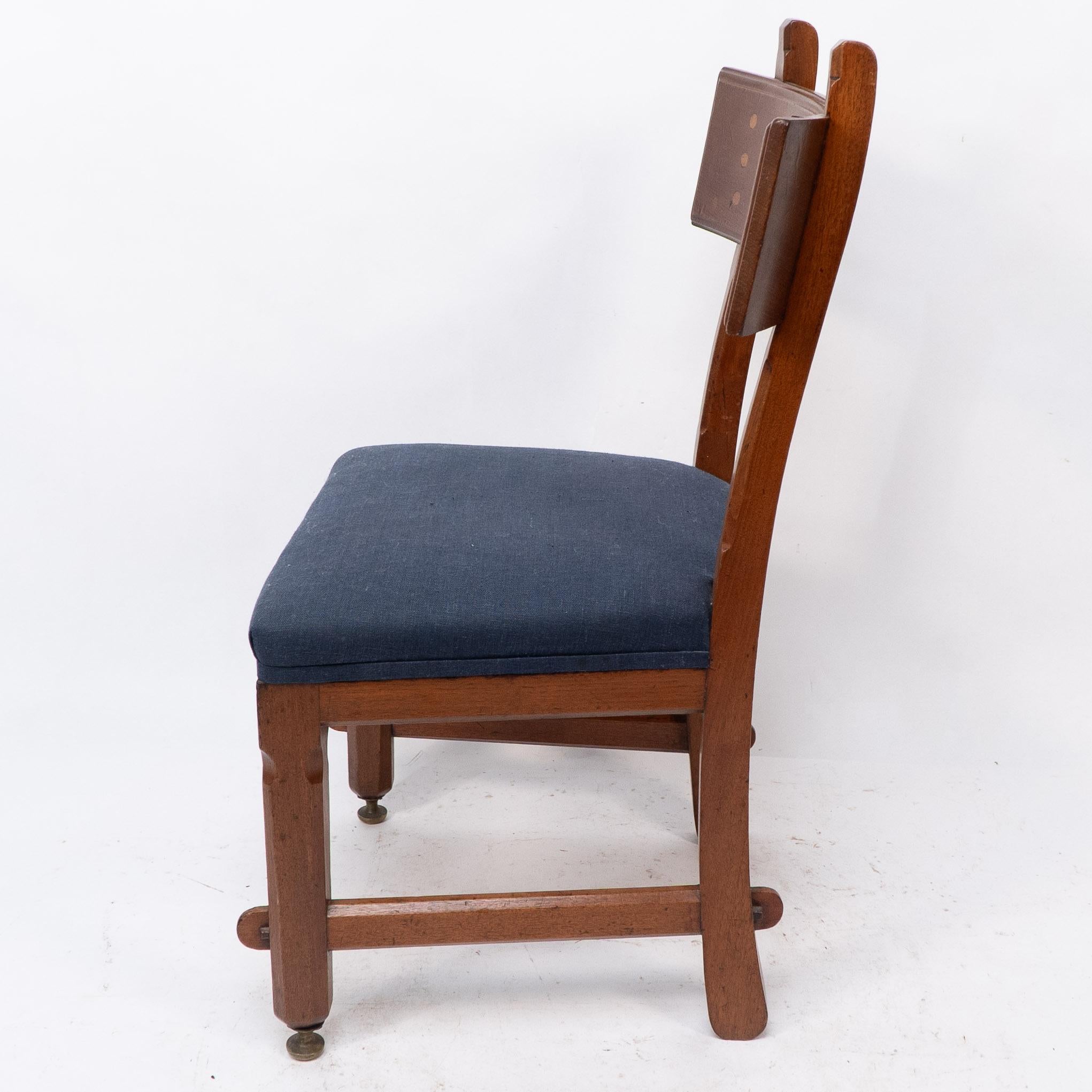 English E W Pugin. A walnut side chair with curvaceous back rest with oak pegs For Sale