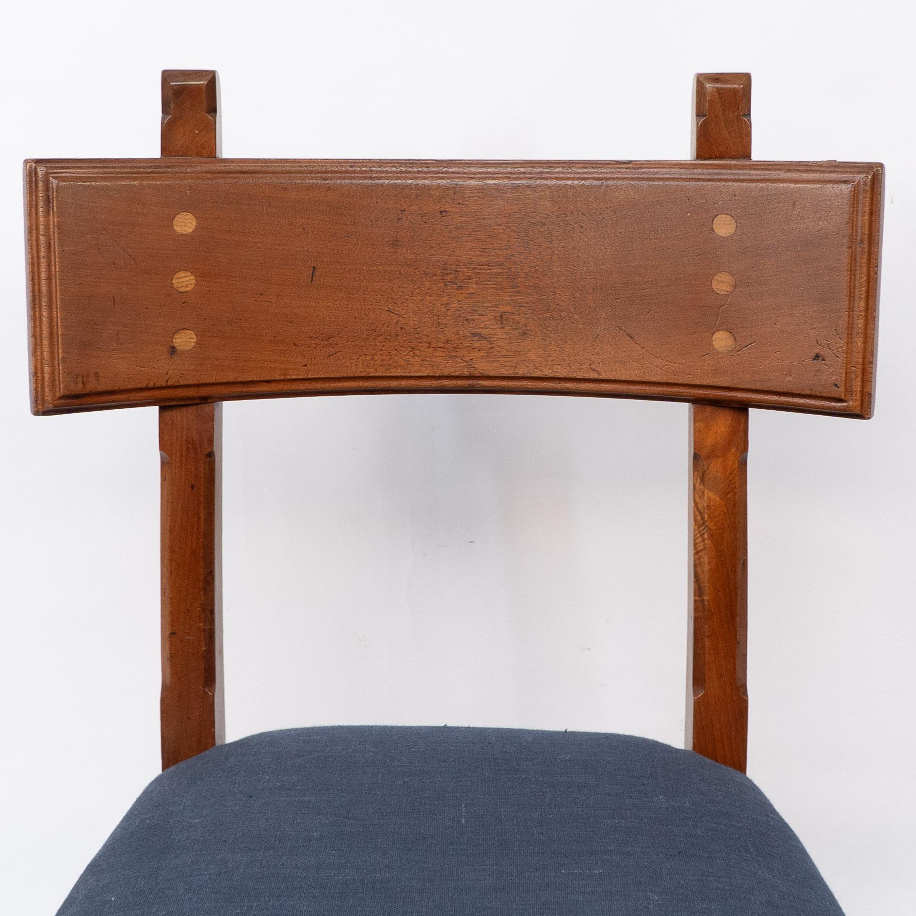 Arts and Crafts E W Pugin. A walnut side chair with curvaceous back rest with oak pegs For Sale