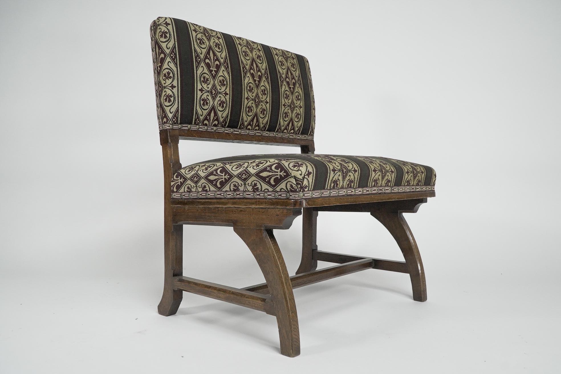 E W Pugin attri. A Gothic Revival oak duet chair with a wider than usual seat. For Sale