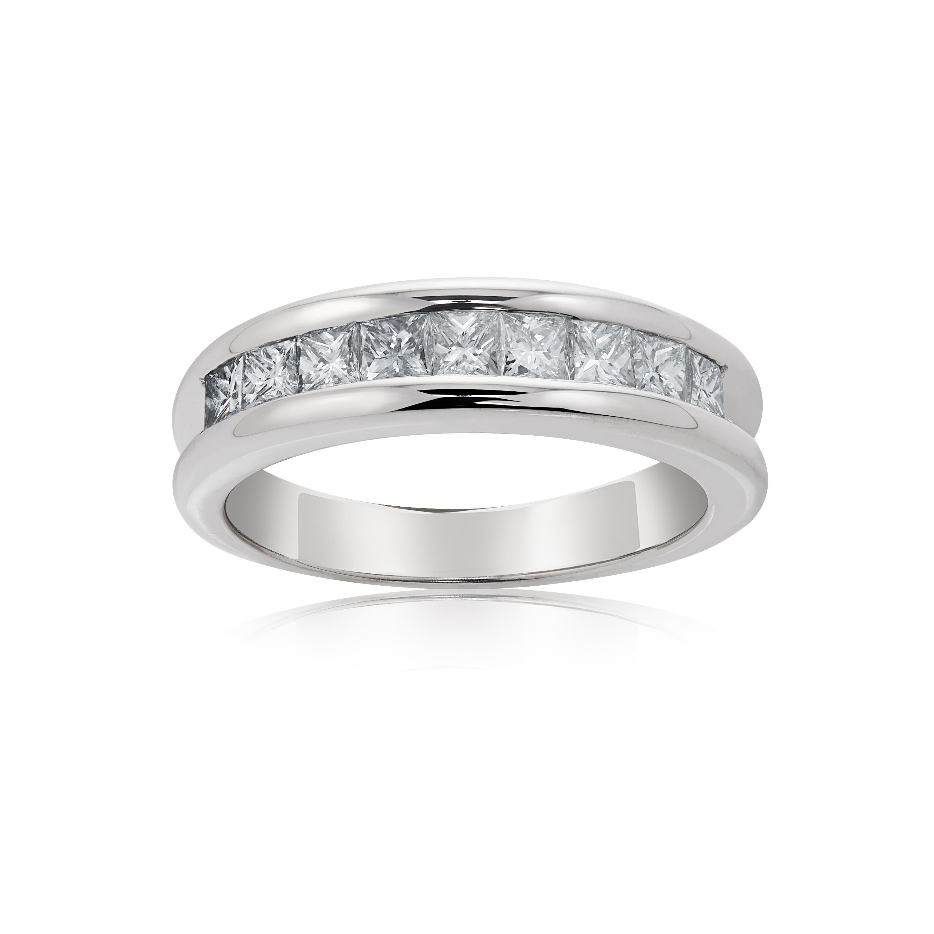 E Wolfe and Company handmade channel-set diamond ring made in 18ct white gold. The ring contains 9 princess-cut diamonds of G colour and VS clarity and weighing a total of .84 carats. It was handmade at our London Workshop during 2021 and weighs