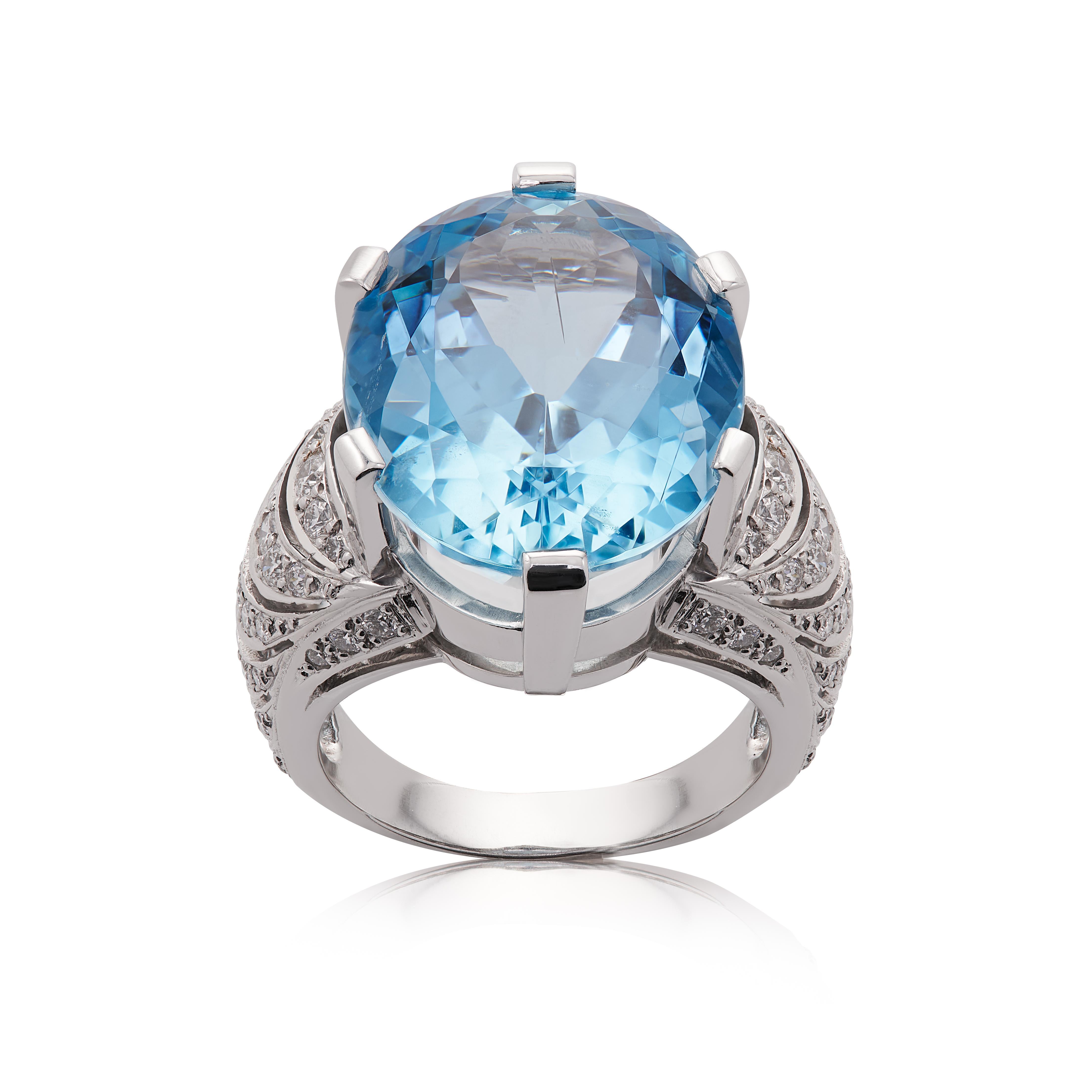 E Wolfe & Co Handmade 18 carat White Gold Aquamarine and Diamond Cocktail Ring. The aquamarine centre stone weighs 17.86 carats and has intricate detail to the sides and shank which have been set with .84 carats of G colour and VS clarity round