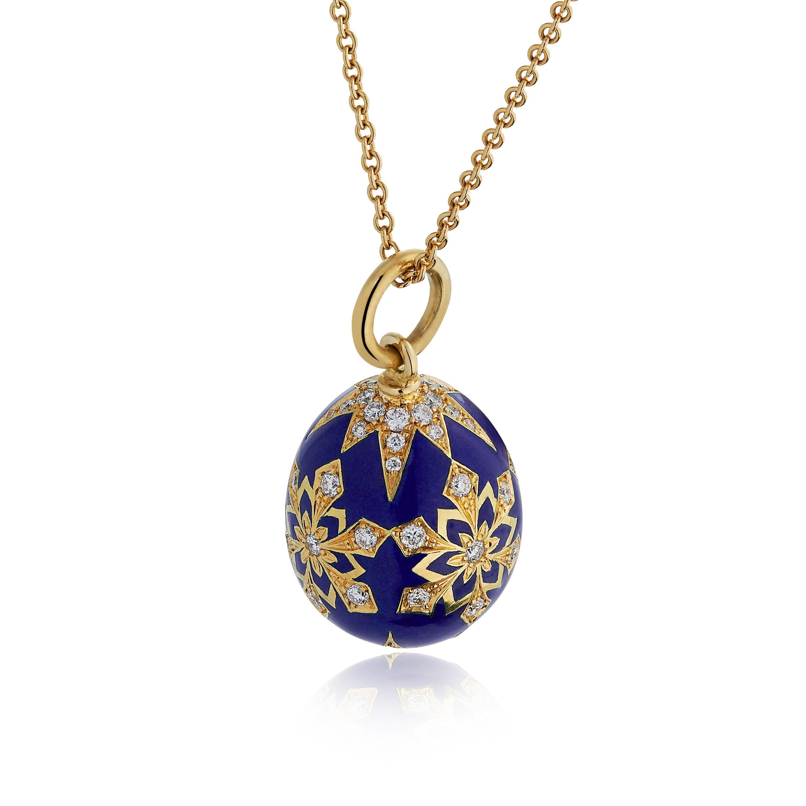 E Wolfe & Company 18 carat Yellow Gold Enamelled Egg Pendant with Diamond-set detail. The Egg has been vitreous enamelled in a rich royal blue colour to surround the snowflake and star detail which has then been diamond-set. The round brilliant cut