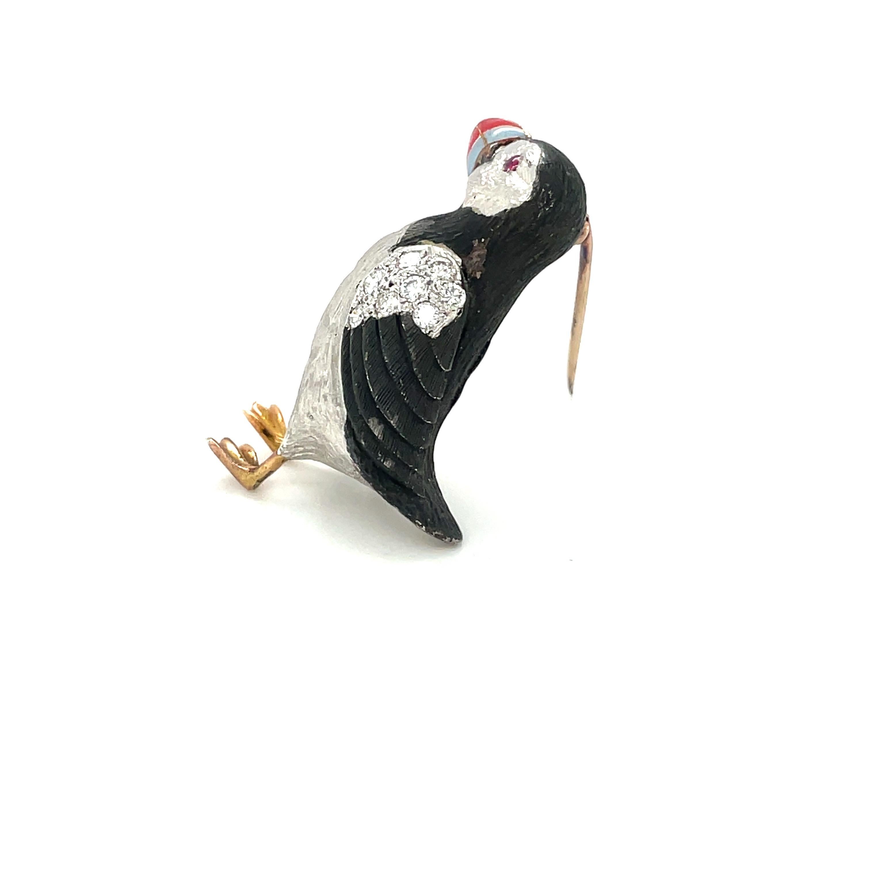 E. Wolfe & Co is a family-run fine jewellery manufacturing workshop, established in 1850 and located in central London. They specialize in creating beautiful bespoke pieces.
This puffin brooch is designed in an 18 karat white gold . It's brushed