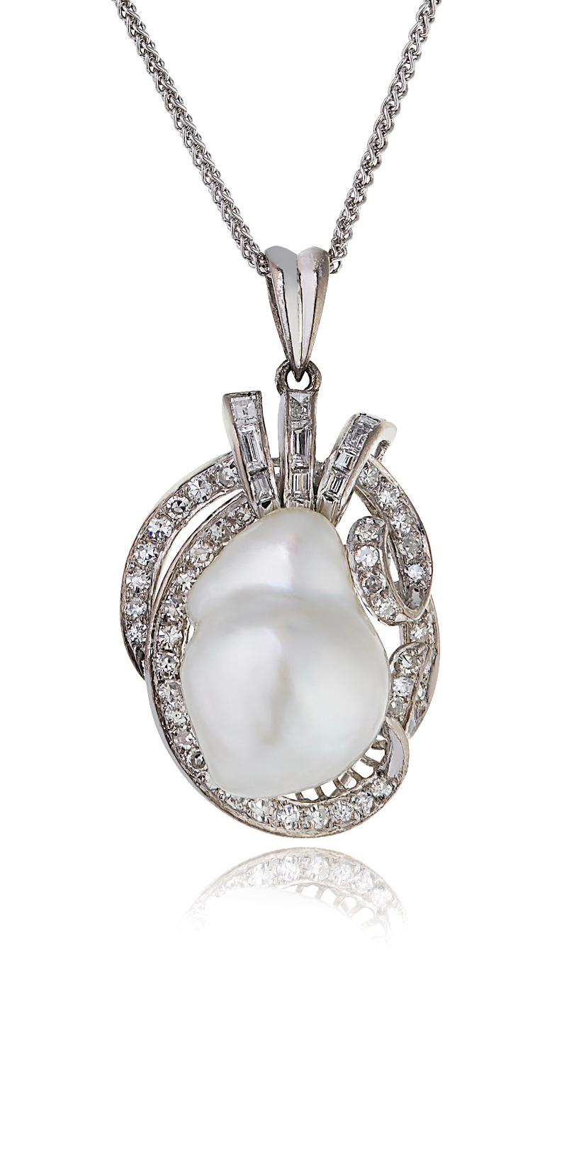 E Wolfe & Company Baroque Pearl and Diamond Pendant in 14 Carat White gold. The baroque cultured pearl has been mounted in an antique style with a mixture of baguette and round brilliant cut diamonds around it. The diamonds have a total weight of