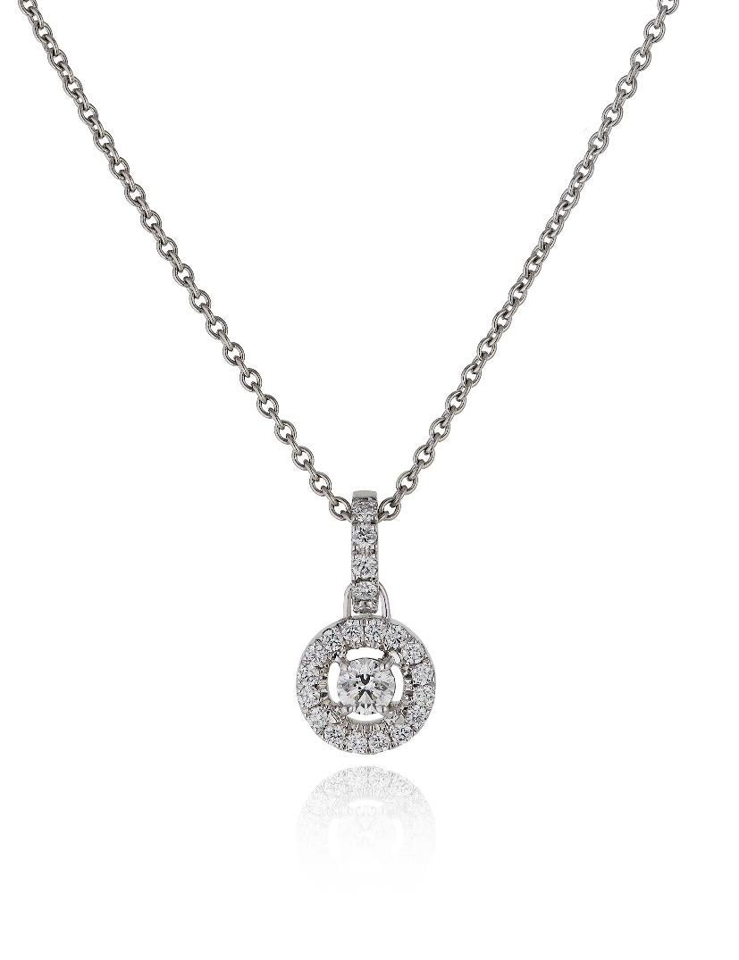 E Wolfe & Company 18 Carat White Gold Diamond-set Pendant. The central round brilliant cut diamond weighs .19 carats and is surrounded by a diamond-set halo and a diamond-set pendant loop which have a weight of .20 carats, bringing the overall total