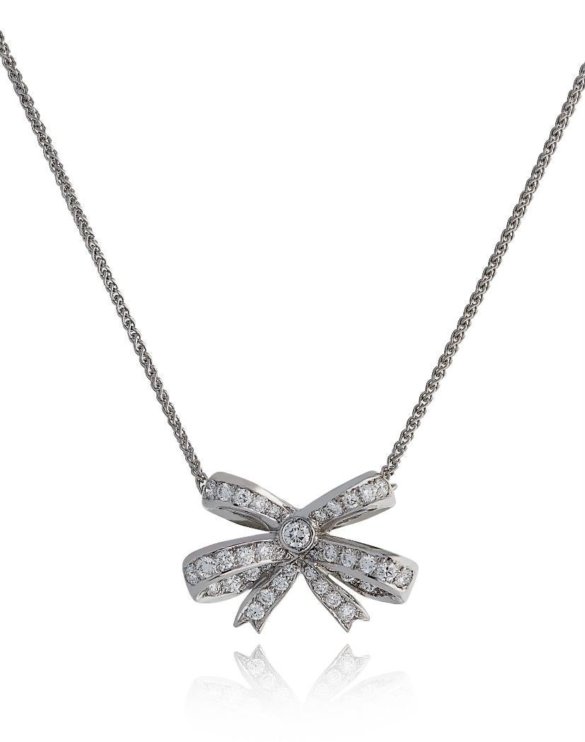 E Wolfe & Company 18ct White Gold Diamond-set Bow Pendant. The round brilliant cut diamonds set to the bow design have a total weight of .66 carats and are of G colour and VS clarity. The pendant was handmade at our London Workshop during 2021 and
