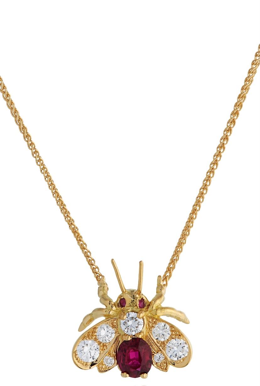 E Wolfe & Company 18ct Yellow Gold Diamond and Ruby Bug Pendant. The oval ruby set to the bug's body weighs .50ct and the round brilliant cut diamonds set to the bug's upper body and wings have a total weight of .41 carats and are of G colour and VS