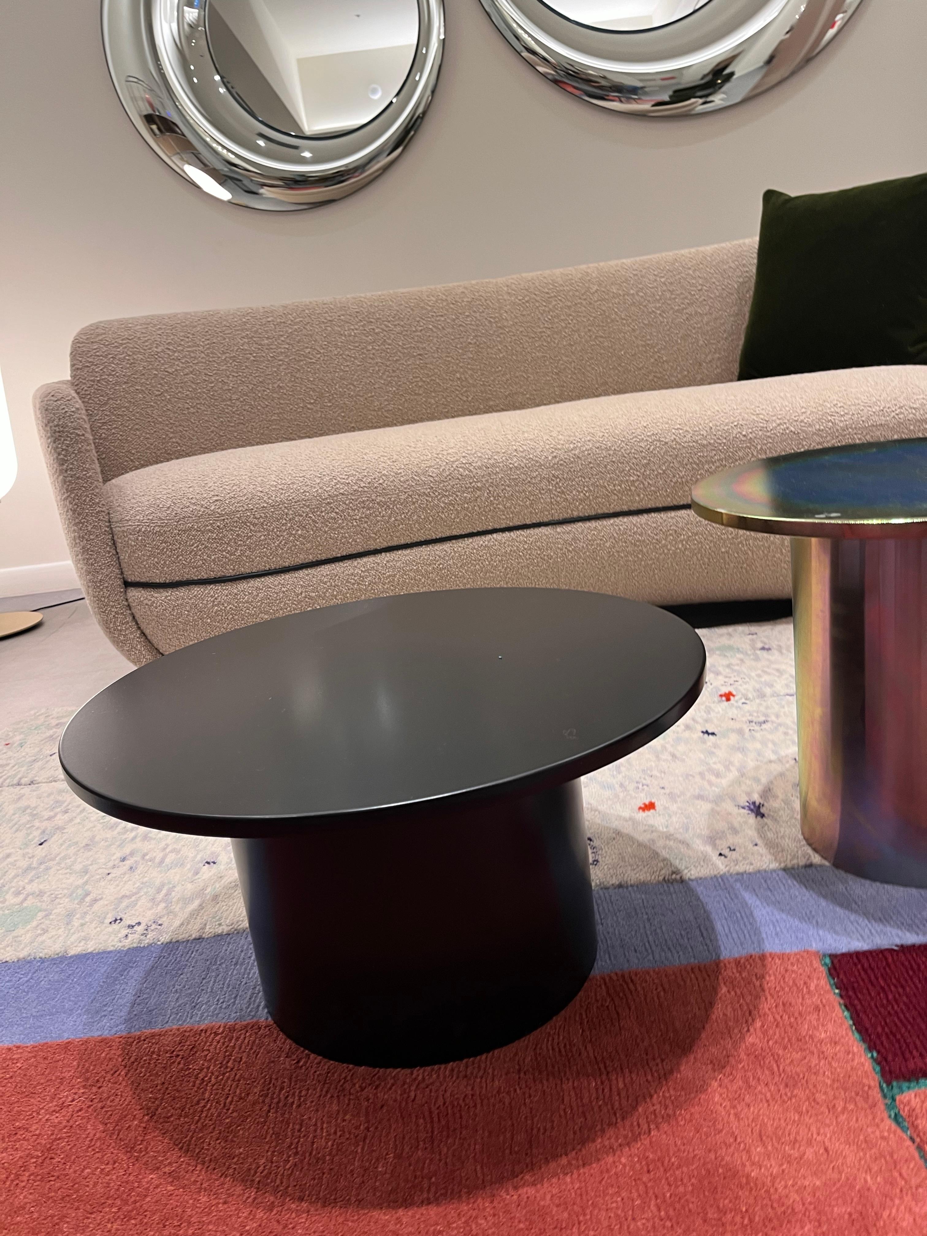 ENOKI COFFEE TABLE JET BLACK POWDER COATED
550x285x324mm

With the smart and playful side table ENOKI, e15 introduces marble for the collection, applying it to novel form. Cleverly toying with material, color and dimensions, the versatile side table