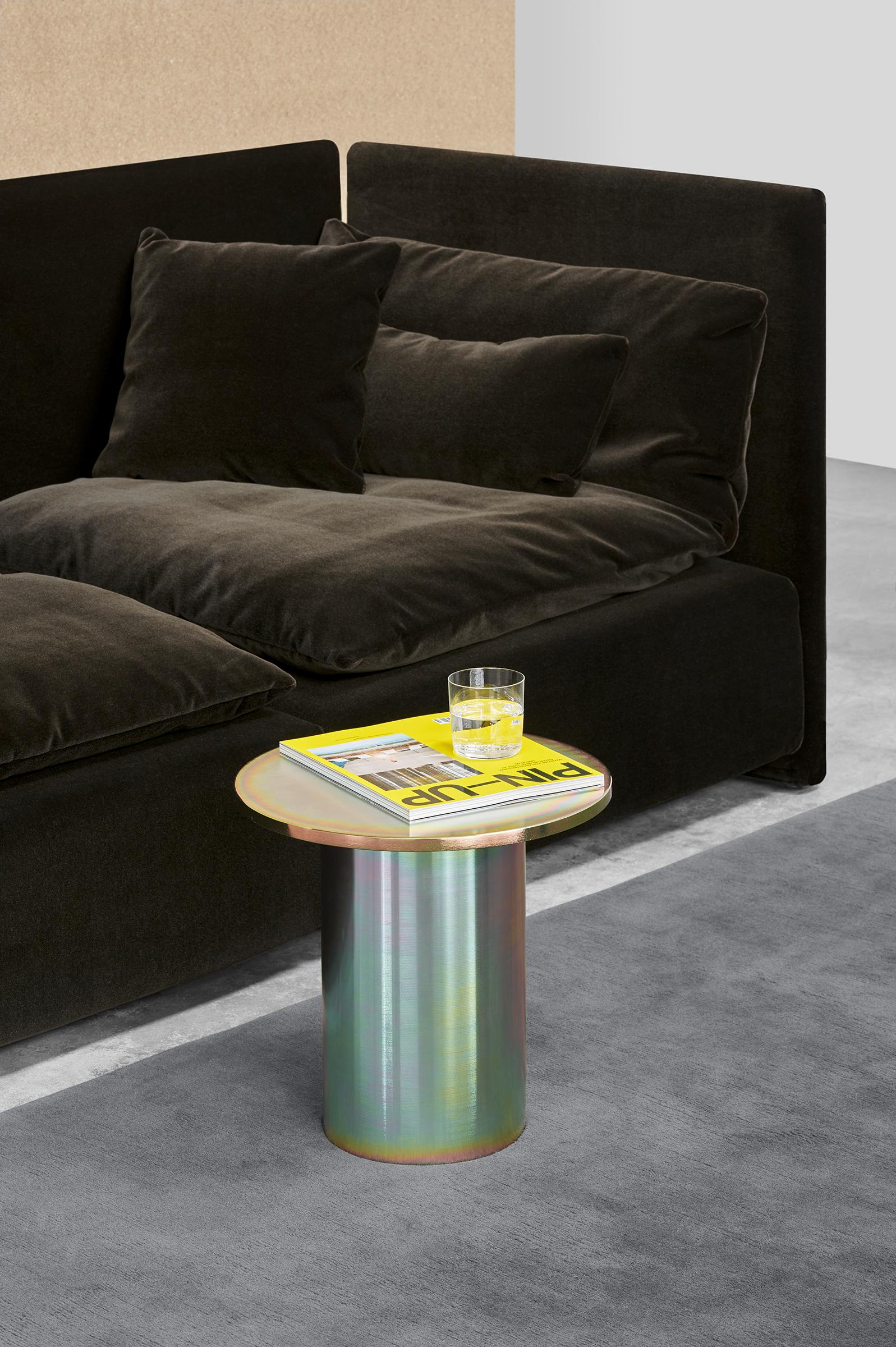 he iconic side table ENOKI by Philipp Mainzer is introduced in all metal, highlighting its essential and minimal form. Made of steel, powder-coated in colours silk grey, pure orange and jet black or zinc-plated in a rainbow hued version the table