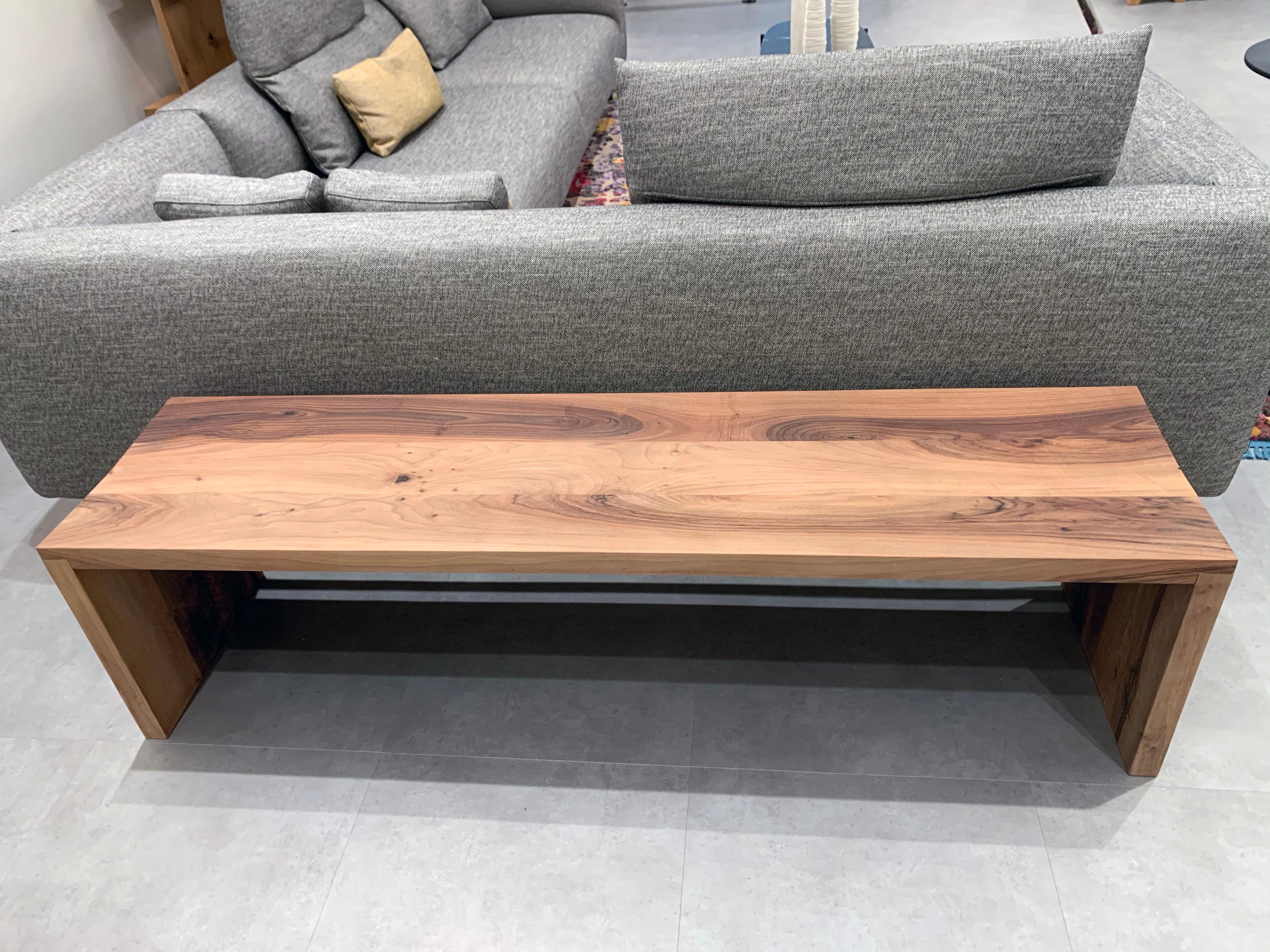 e15 Calle Bench
Design: Philipp Mainzer, 2002
Measures: 63” L x 15.75” D x 16.5” H
European walnut oiled.
The solid wood bench Calle consists of a contoured seat, two sides flushed with the seat and a support beam underneath. The top surface tapers