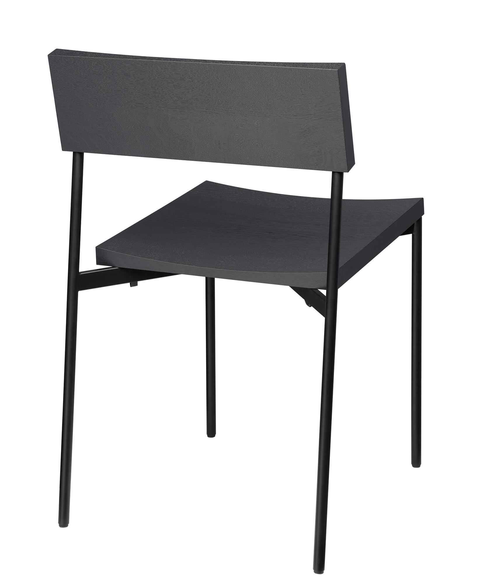 Chair Henning with its minimal and linear Silhouette unifies a shaped solid wood seat and backrest with powder-coated steel or brushed stainless steel frame. Henning is a comfortable and elegant stackable chair that serves various interior
