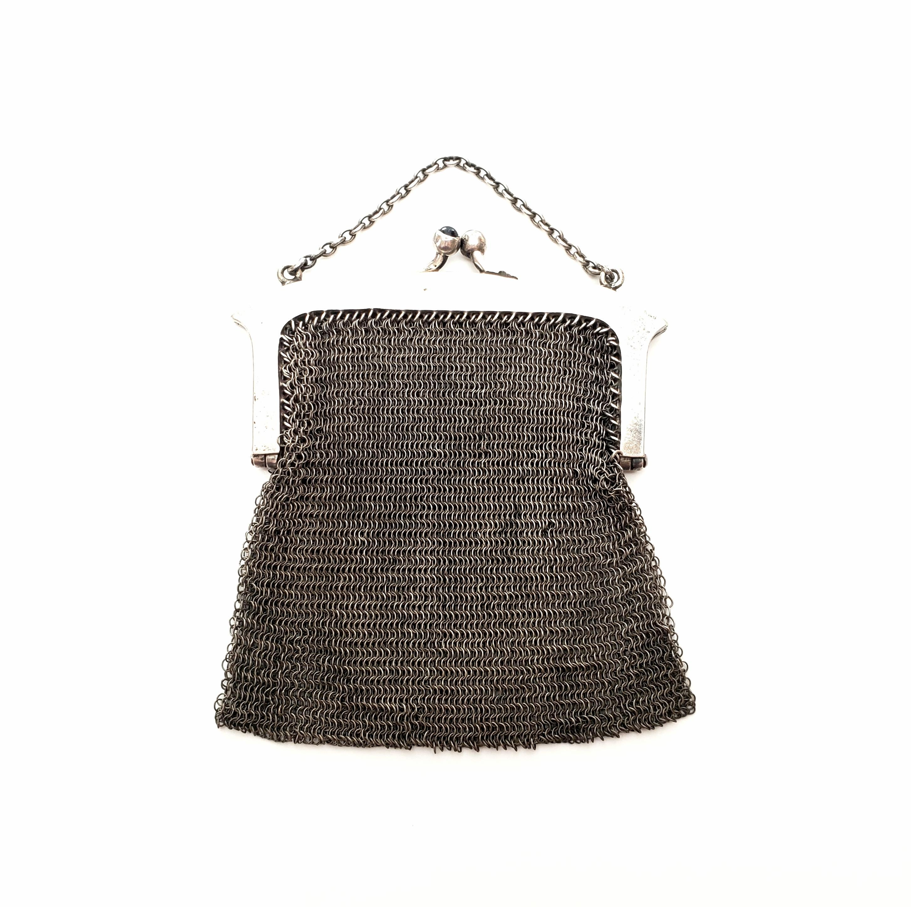 Antique sterling silver mesh coin purse with short chain strap by E.A. Bliss Co.

E.A. Bliss manufactured chains and novelties from 1878. They moved from MA to CT in 1890, renamed to Napier-Bliss in 1920, Napier in 1922 and closed in 1999. A