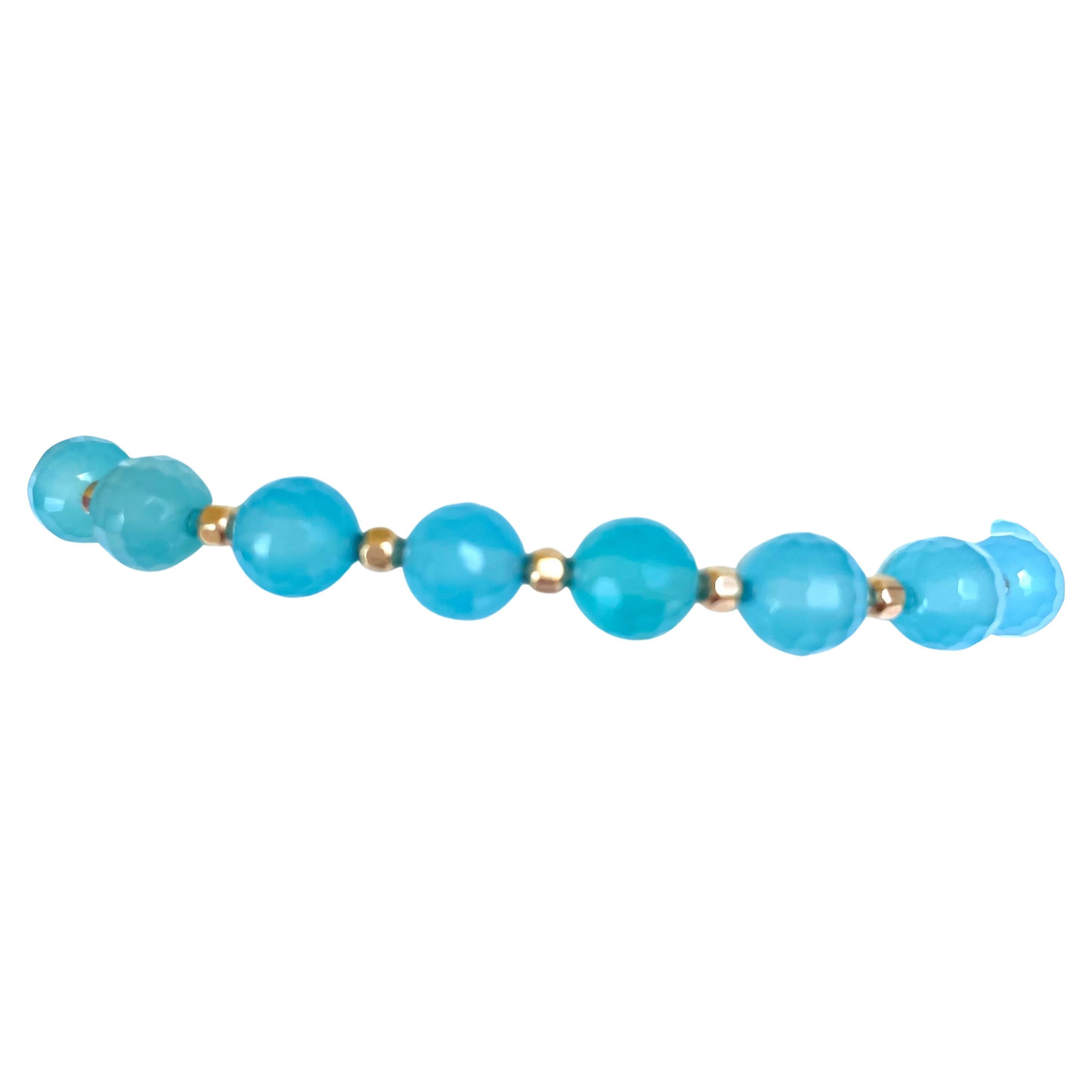 
Description
Sea Blue Chalcedony quartz with gold filled faceted balls stretchy bracelet.
Item # B1329

Materials and Weight
Chalcedony quartz 54 carats, 8mm, round beads.
Gold filled 3mm faceted balls, round. 16 pieces.

Dimensions
Size 7