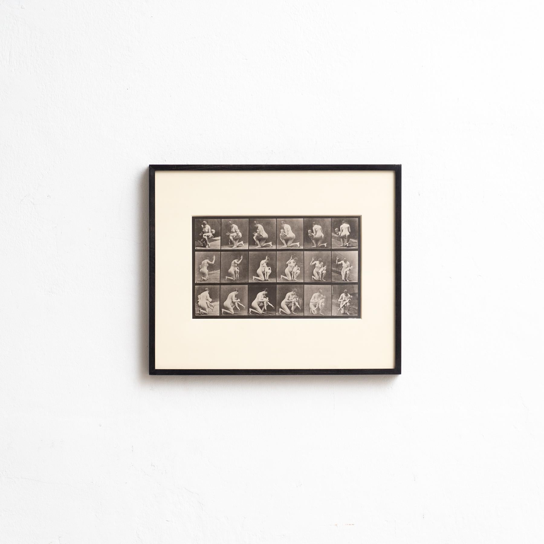 Explore the pioneering work of Eadweard Muybridge with this framed black and white photograph, capturing his iconic study of a woman in motion. This photograph, printed in heliogravure, is part of a limited edition of 1000 copies, published in Milan