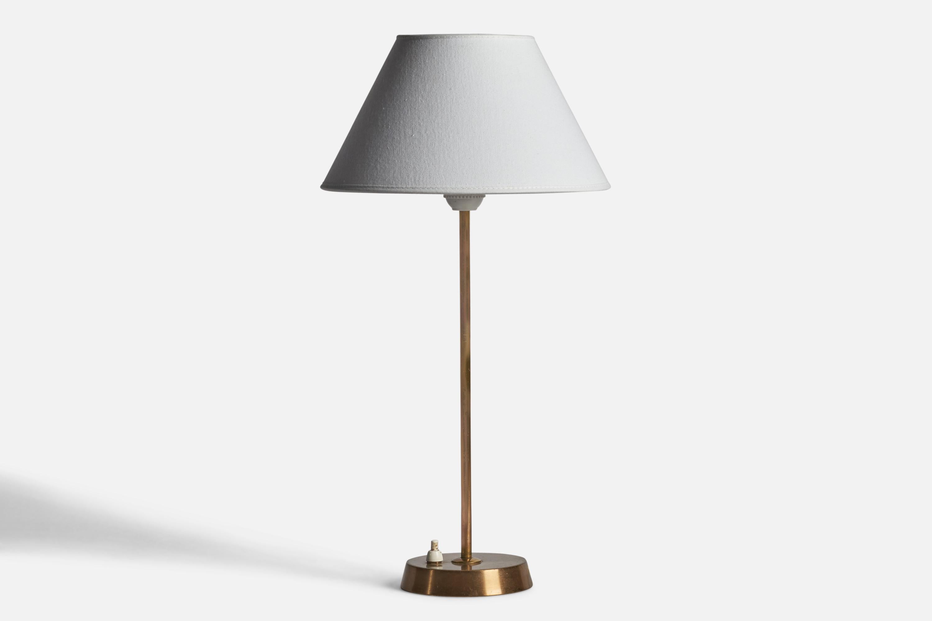 A brass table lamp designed and produced by EAE, Sweden, 1950s.

Dimensions of Lamp (inches): 15.45” H x 4.5” Diameter
Dimensions of Shade (inches): 7” Top Diameter x 10” Bottom Diameter x 5.5” H 
Dimensions of Lamp with Shade (inches): 18.35” H x