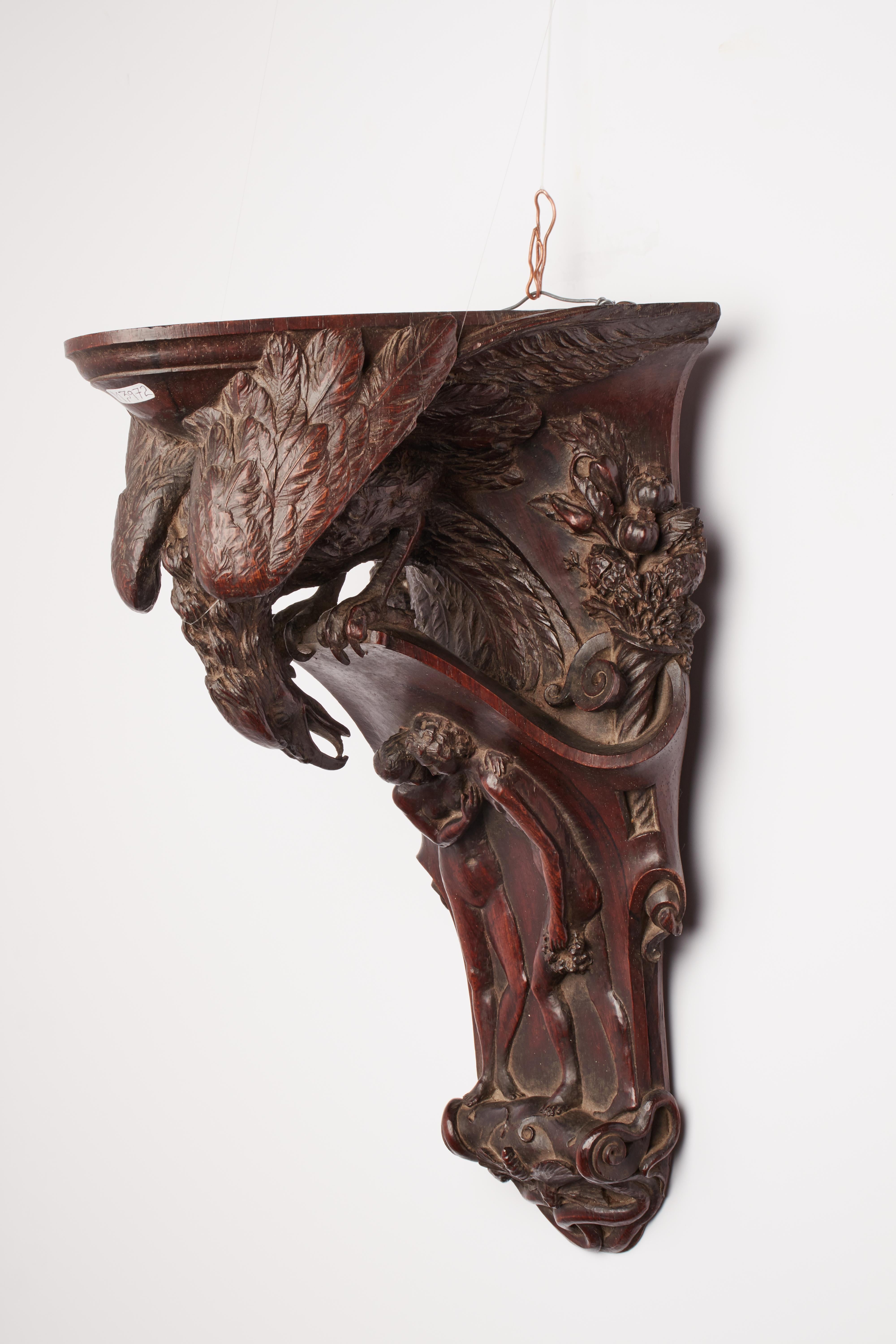 Little shelf, carved rosewood, depicting an eagle watching Adam, Eve, and a bee. Signed G.Benelli, Italy 1831.