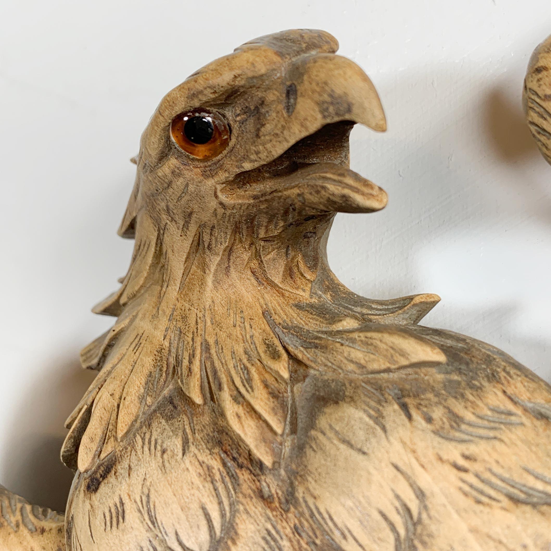 Fantastic hand carved Eagle gripping a crescent bevelled mirror, dating to the late 19th century, Swiss Black Forest. The carving still has its’ original glass eye and is in exceptional condition

There are a couple of minor losses to the claws,