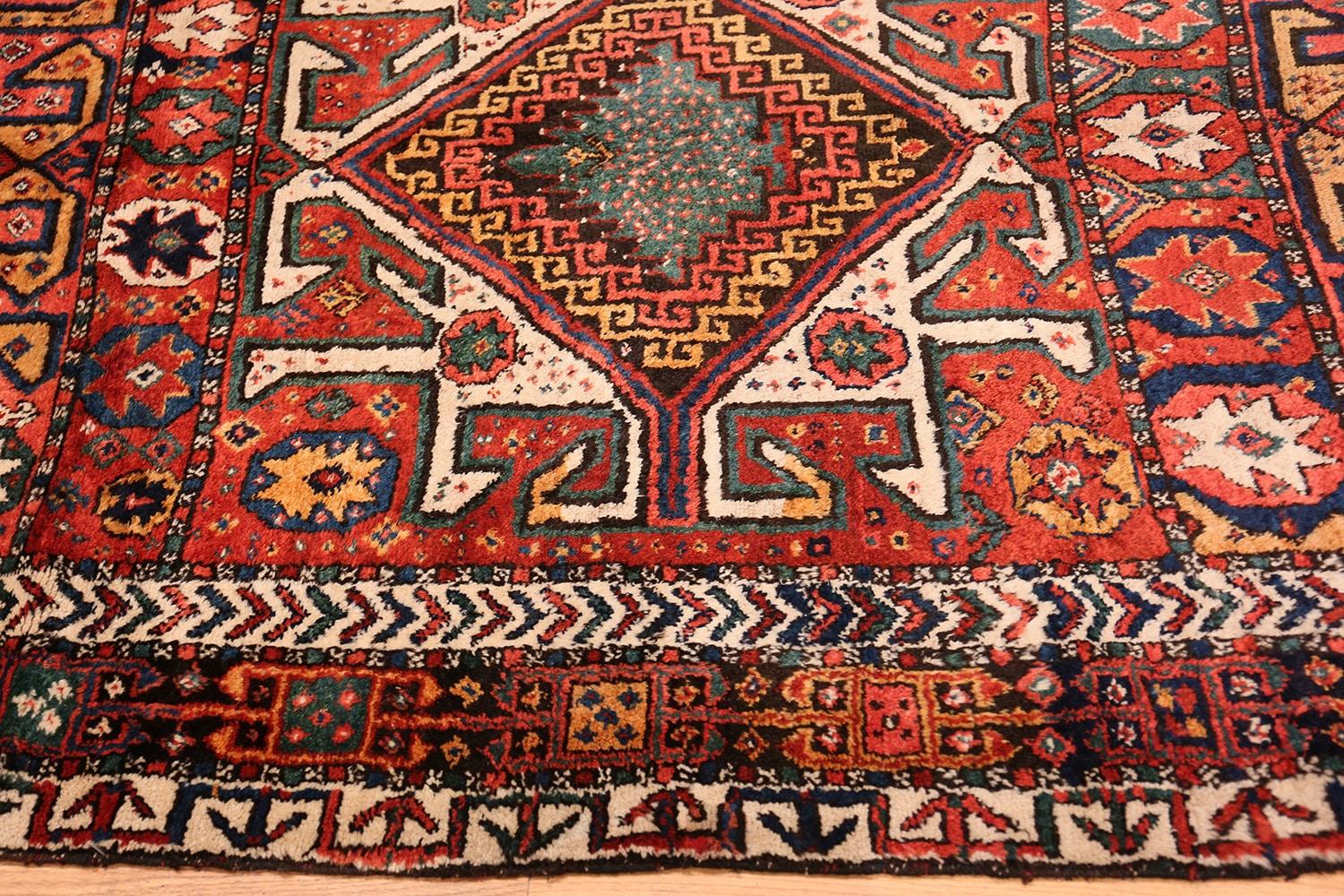 Colorful Eagle Kazak design antique tribal Persian Kurdish rug. Circa Date: 1910. Size: 5 ft 3 in x 12 ft 3 in (1.6 m x 3.73 m). 

 