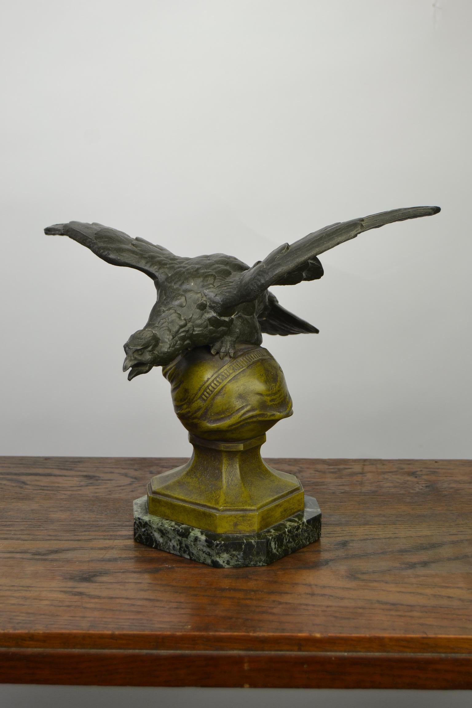 French Art Deco - Art Nouveau Sculpture - Statue - Desk Ornament by Charles Théodore Perron (1862-1934), France. 
The Eagle has spread Wings and an open mouth and is very detailed. 
Green with black marble base, bronze globe and a green - black