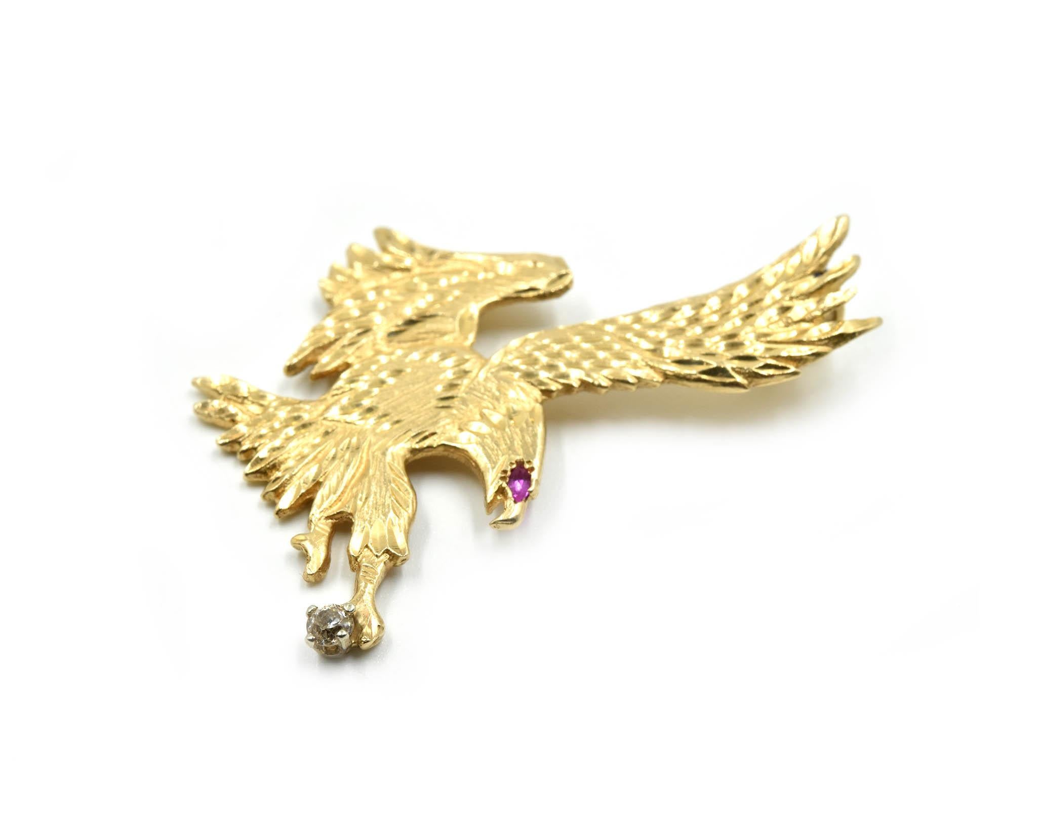 Designer: custom design
Material: 14k yellow gold
Dimensions: eagle pendant measures 2-inches long and 1 1/2-inches wide
Weight: 11.42 grams
