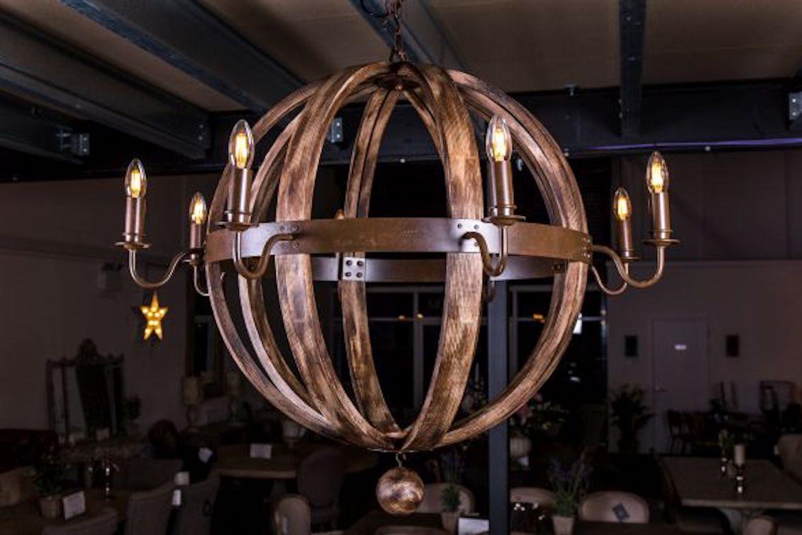 A stunning Ealing wooden ball chandelier range, 20th century.

This wooden ball chandelier is available in two sizes.

The light fitting comes from our range of contemporary ceiling and wall lights, and features an aged metal and steam-bent