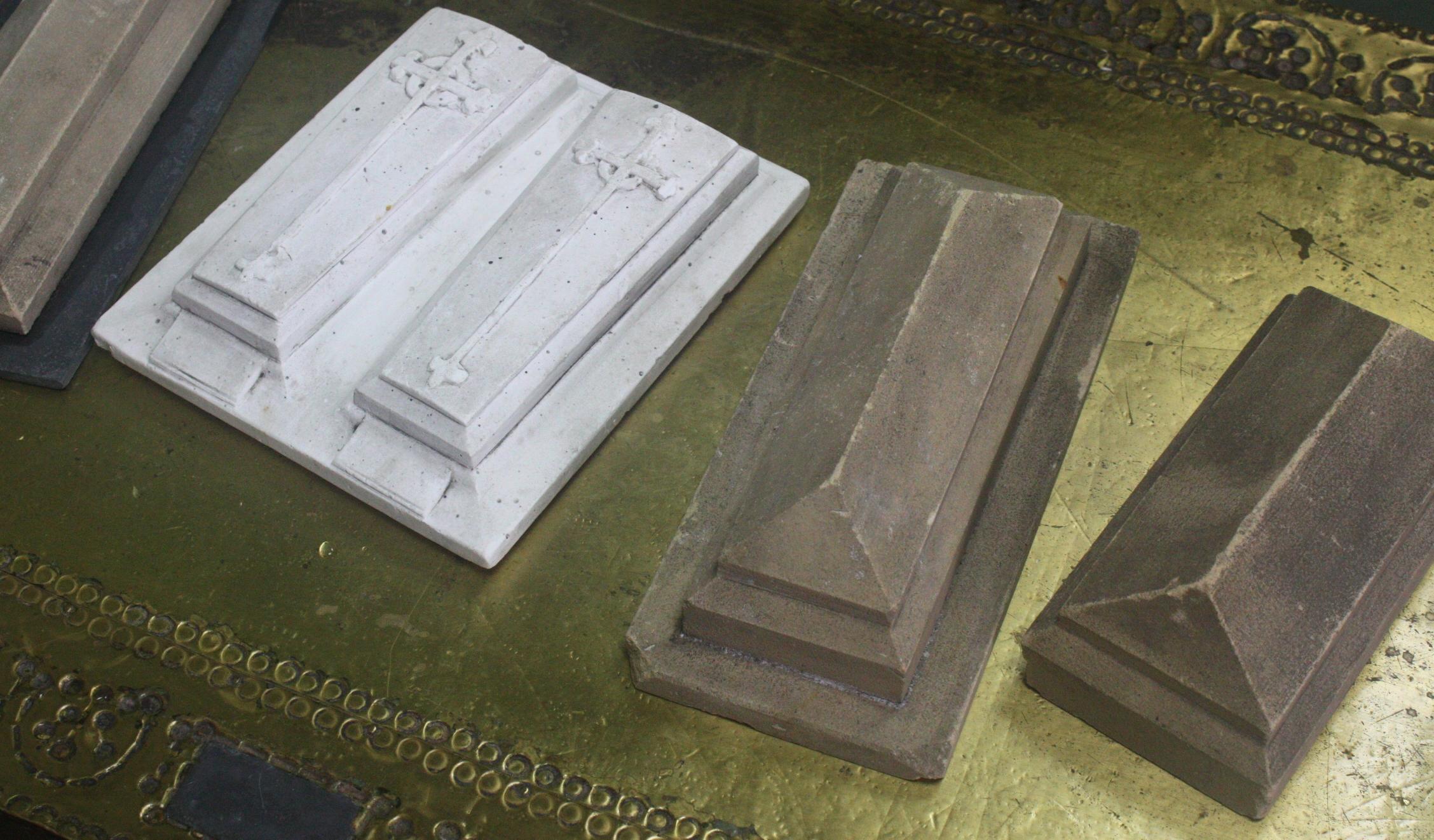 A collection of four undertakers tombstone samples for prospective customers. One is cast in plaster, the other three examples in carved sandstone. Age related chips and discoloration. Early 20th century in age, would make for decorative paper