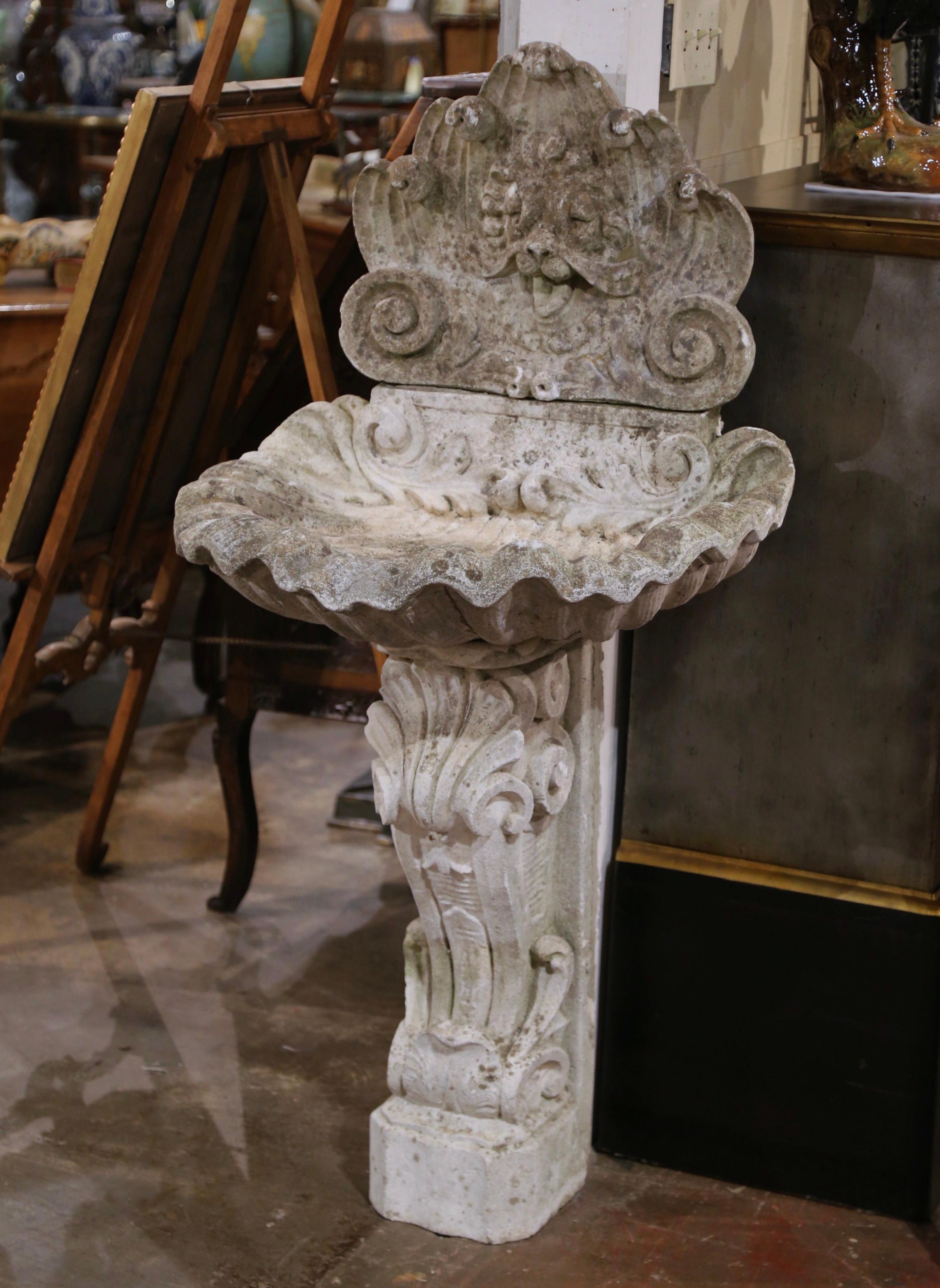 Louis XV  Ealy 20th Century French Carved Weathered Stone Wall Fountain with Shell Decor