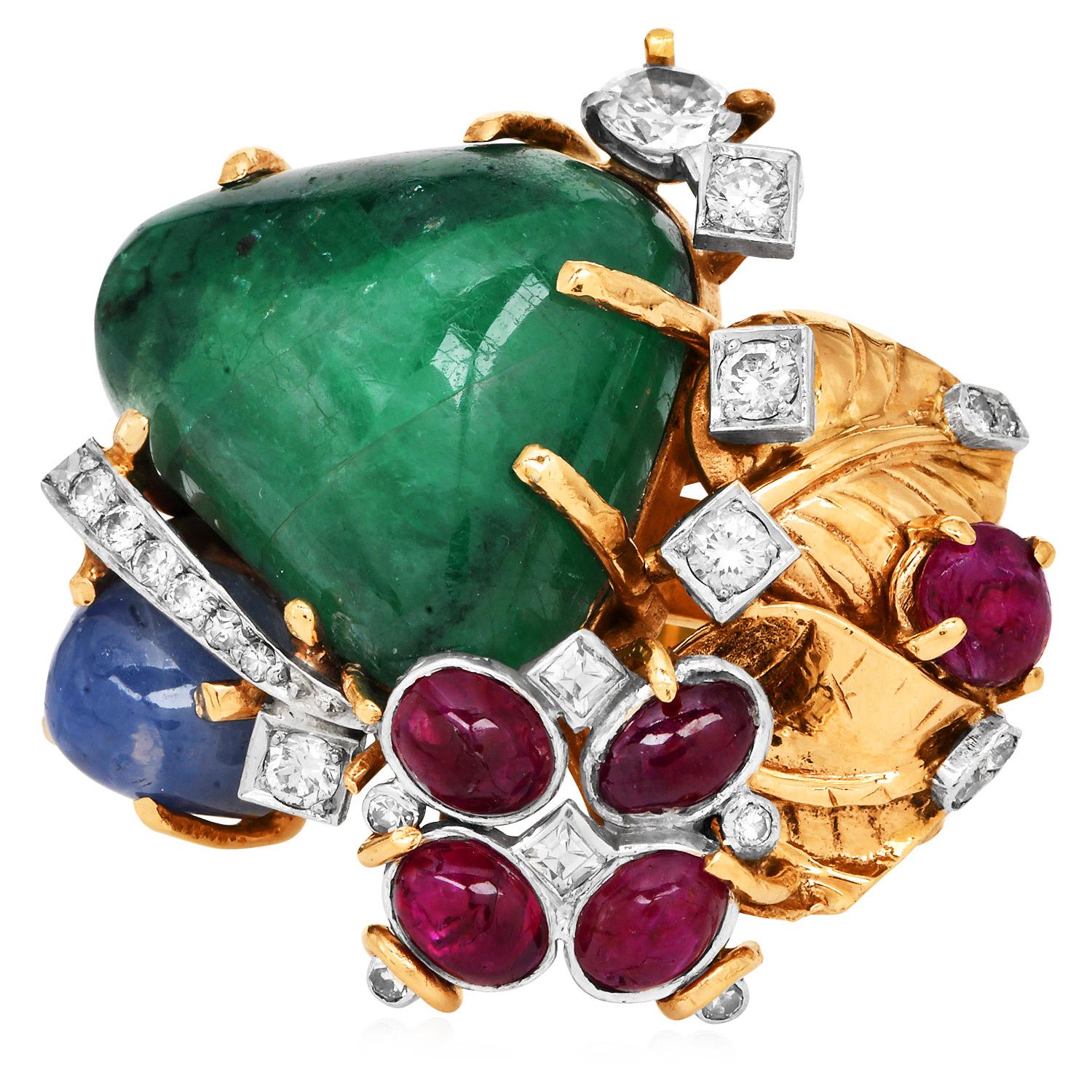 A bold and iconic design from the renowned Seaman Schepps, this vintage multi-gem cocktail ring is a radiant display of color, craftsmanship, and character. Expertly handcrafted in 18k yellow gold, the ring features an exquisite collection of