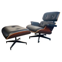 Used Eames 50th Anniversary Lounge Chair and Ottoman, Cherry and Black Leather 2006