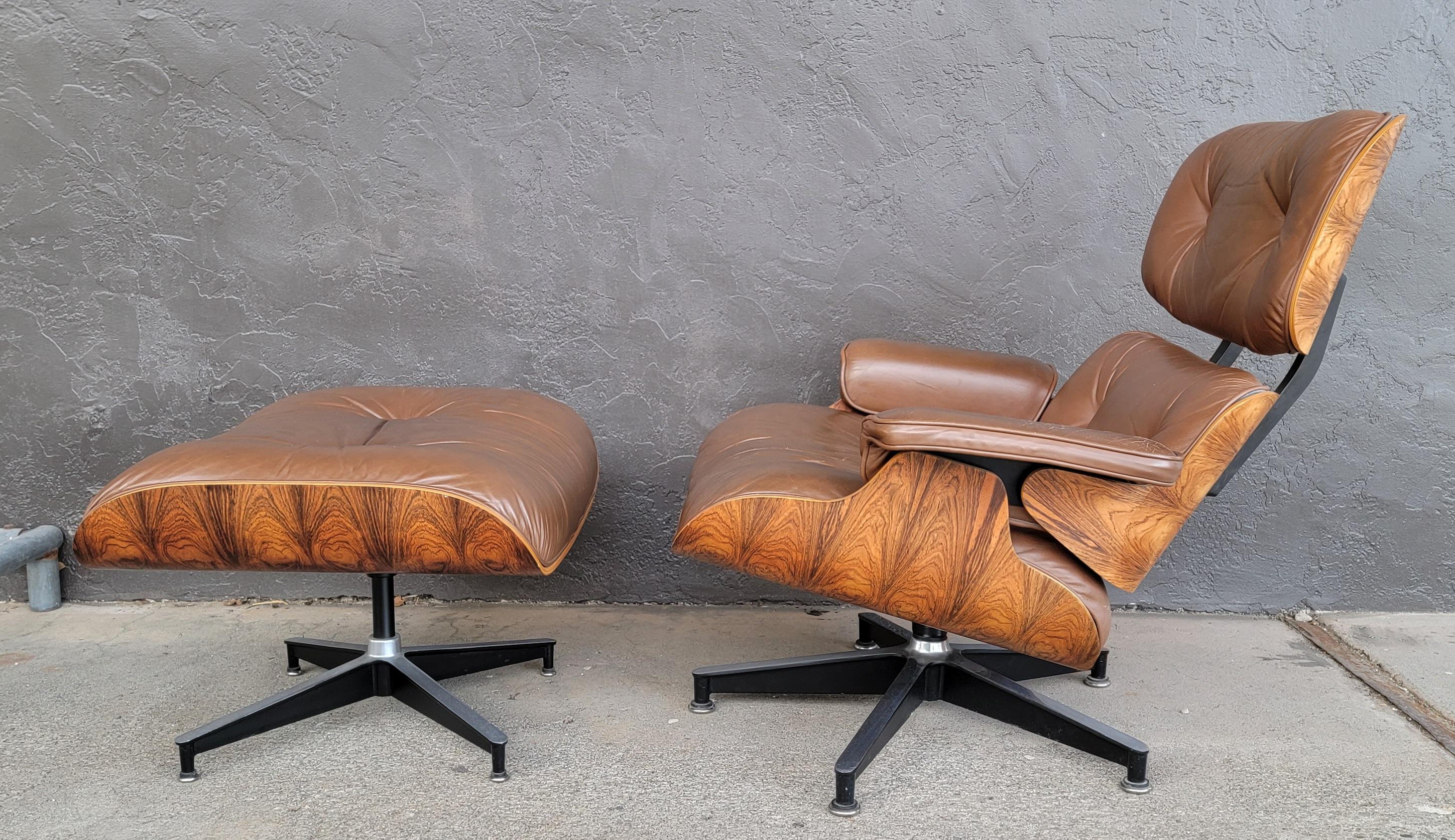 Vintage Eames 670 671 rosewood lounge chair and ottoman. Circa. late 1970's to 1980's. Beautiful wood grain to rosewood. Both pieces retain Herman Miller label. Nice example of a vintage and iconic Eames Lounge Chair.