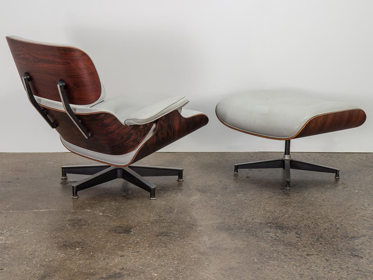 Original 670 lounge chair and matching 671 ottoman, designed by Charles and Ray Eames for Herman Miller. Custom light gray leather is in nice condition-lovingly worn and comfortably plush, with a nicely broken-in patina. Rosewood frame has been