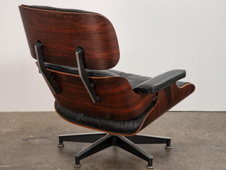 Iconic 670 lounge chair and 671 ottoman, designed by Charles and Ray Eames for Herman Miller. A luxuriously soft and comfortable design. Frame showcases the gorgeous Brazilian rosewood selection, which is polished and gleaming. Our 1960s chair