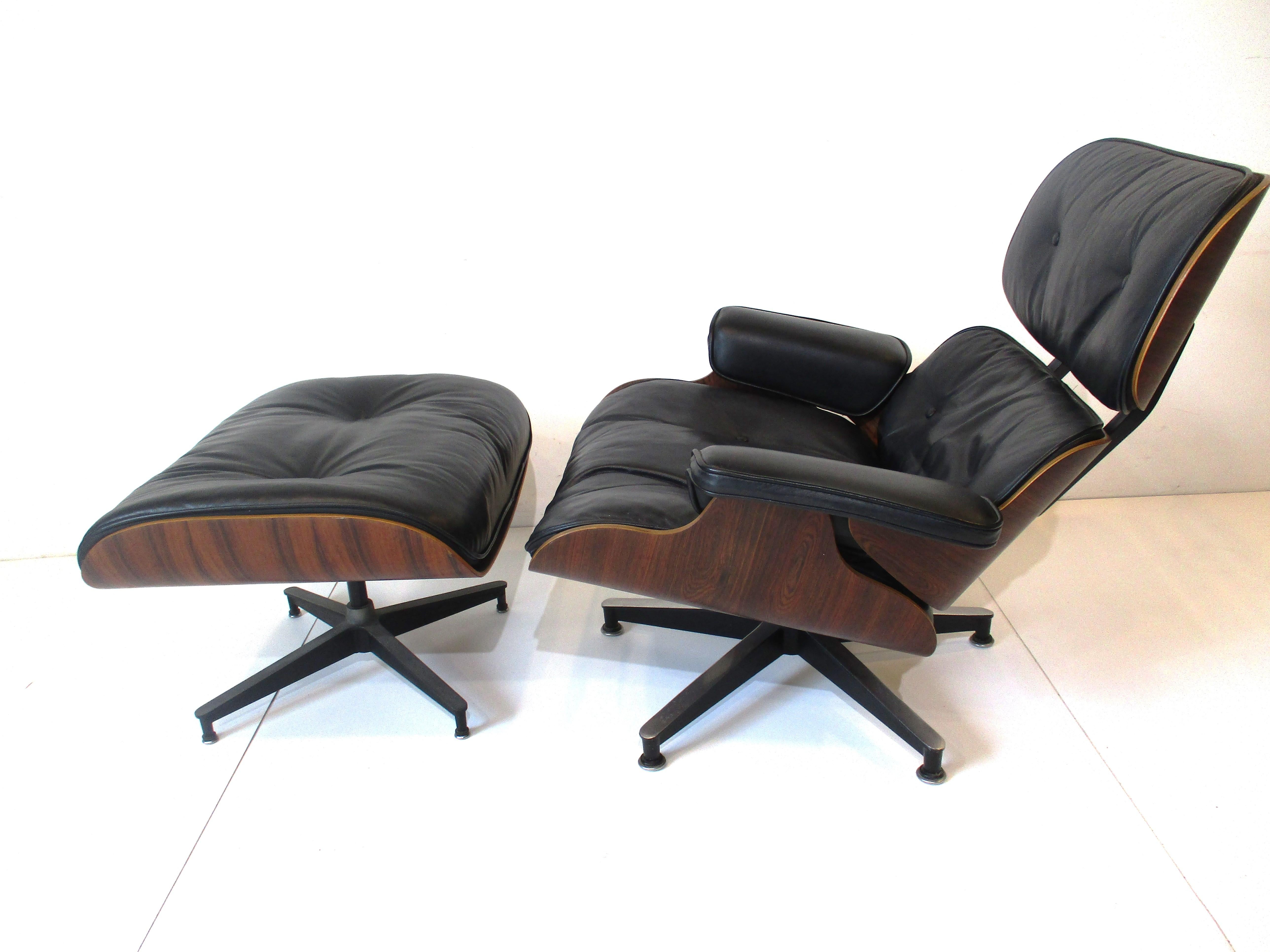One of the most iconic designs from the Mid Century period the Eames 670 lounge chair with 671 ottoman .In the very desireable soft black leather matched with Brazilian rosewood frame sitting on cast aluminum star bases . Manufactured by the Herman