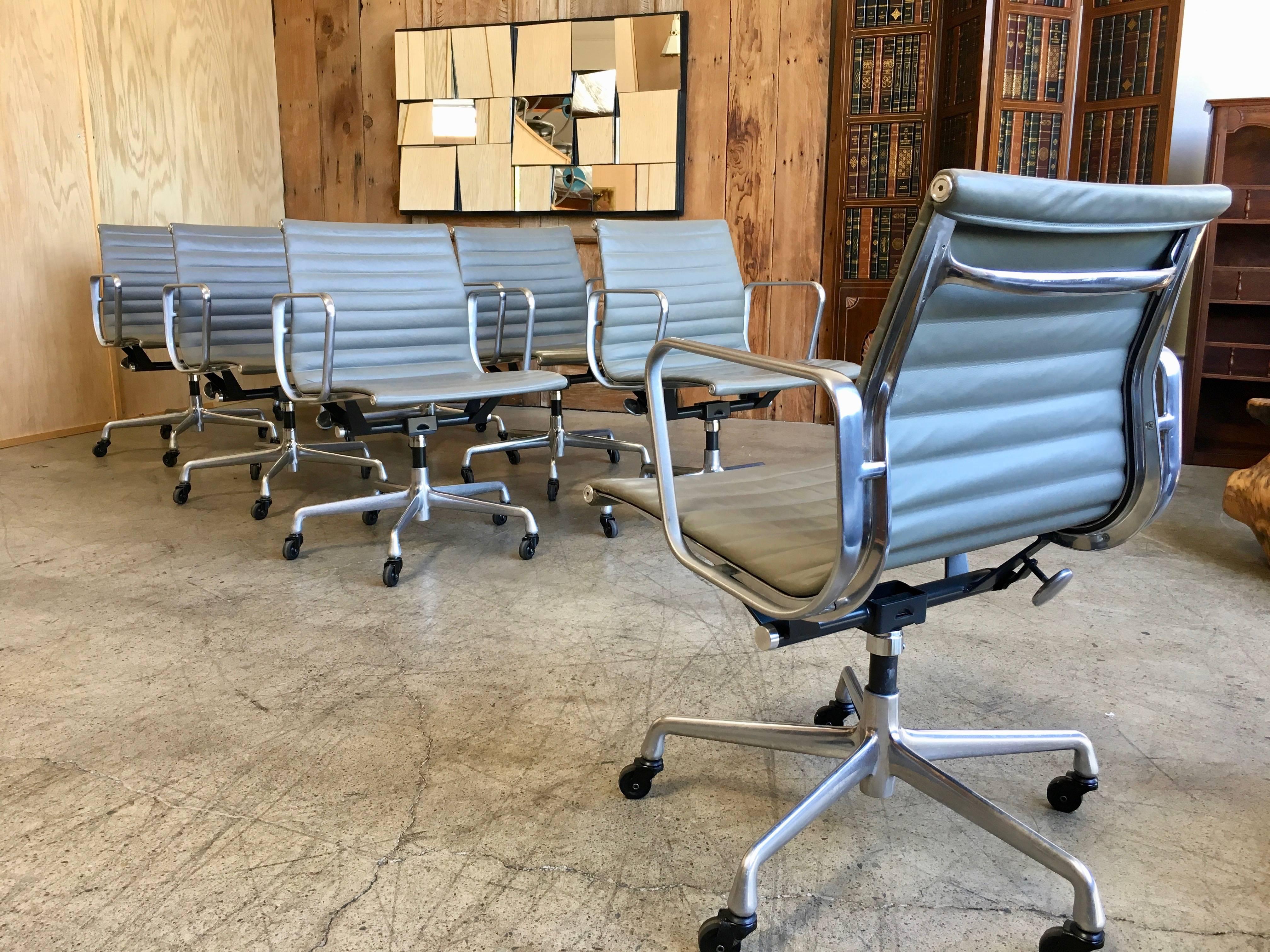 Set of eight management chair with grey leather.