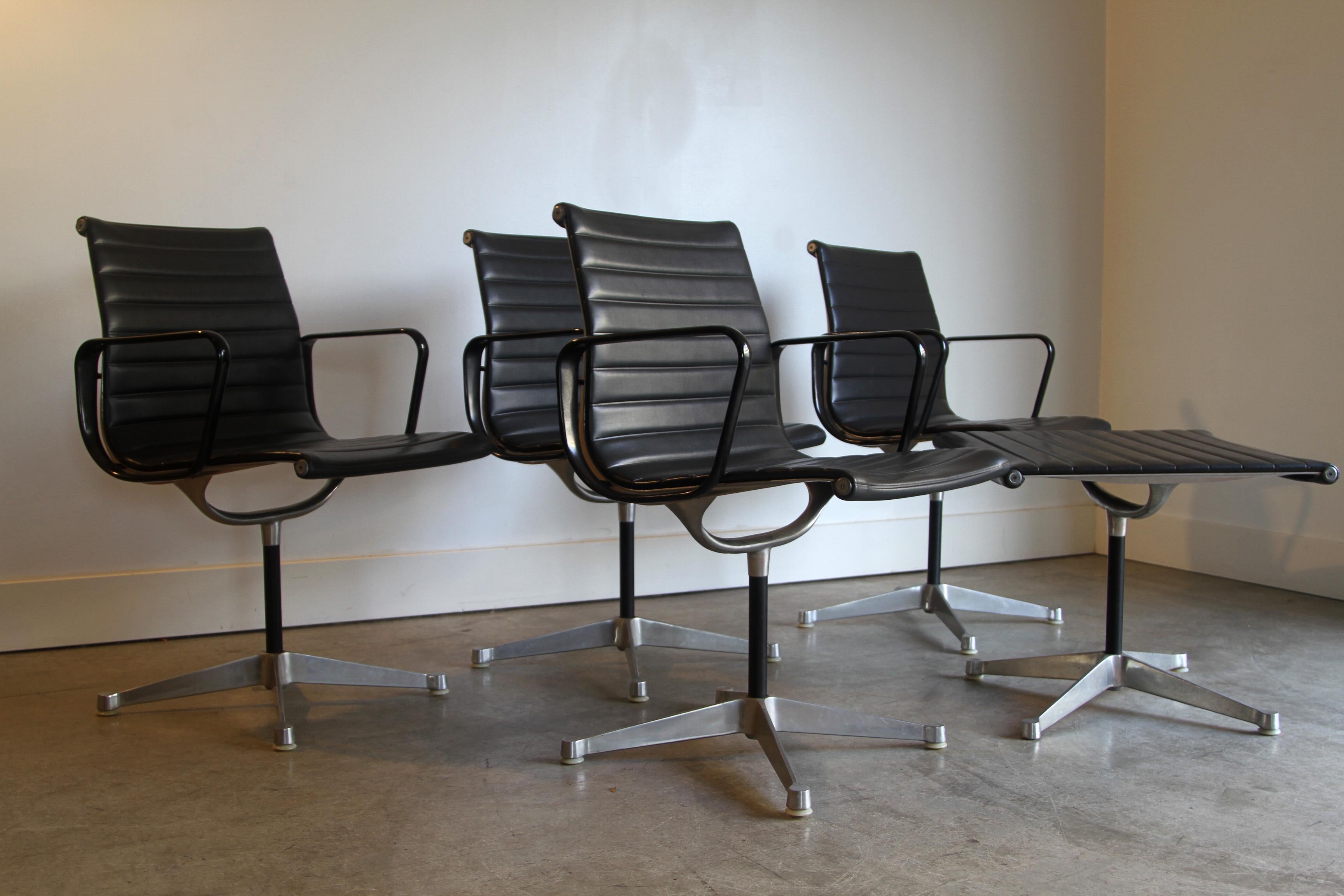 Eames Aluminum Group Black Leather Chairs Herman Miller 4 Available In Good Condition For Sale In St. Louis, MO