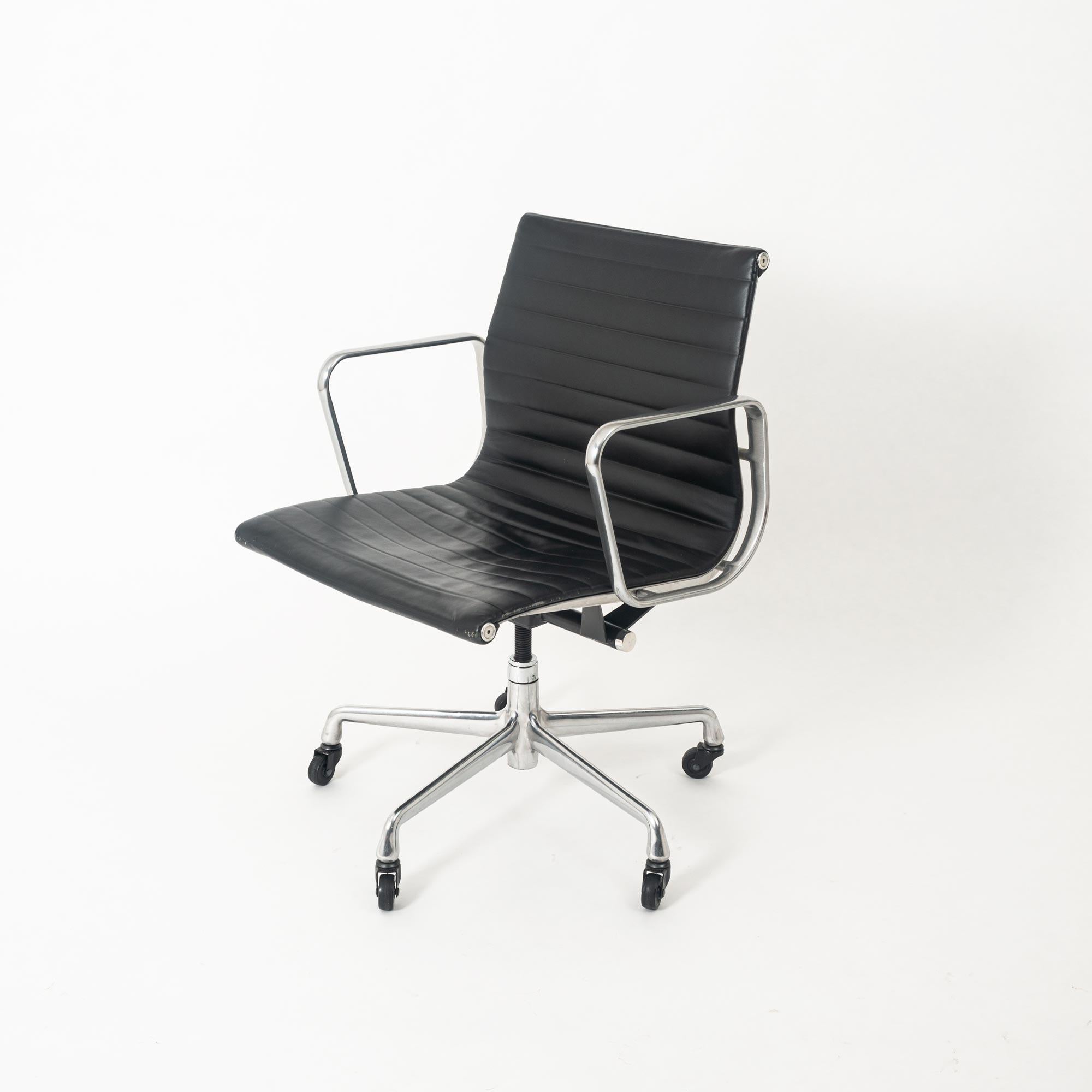 Designed by Charles and Ray Eames and offered by Herman Miller, this chair is as comfortable as it is a timeless classic. This Aluminum Group seat has a genuine black leather upholstery. The leather seat is a self-contouring, even weight