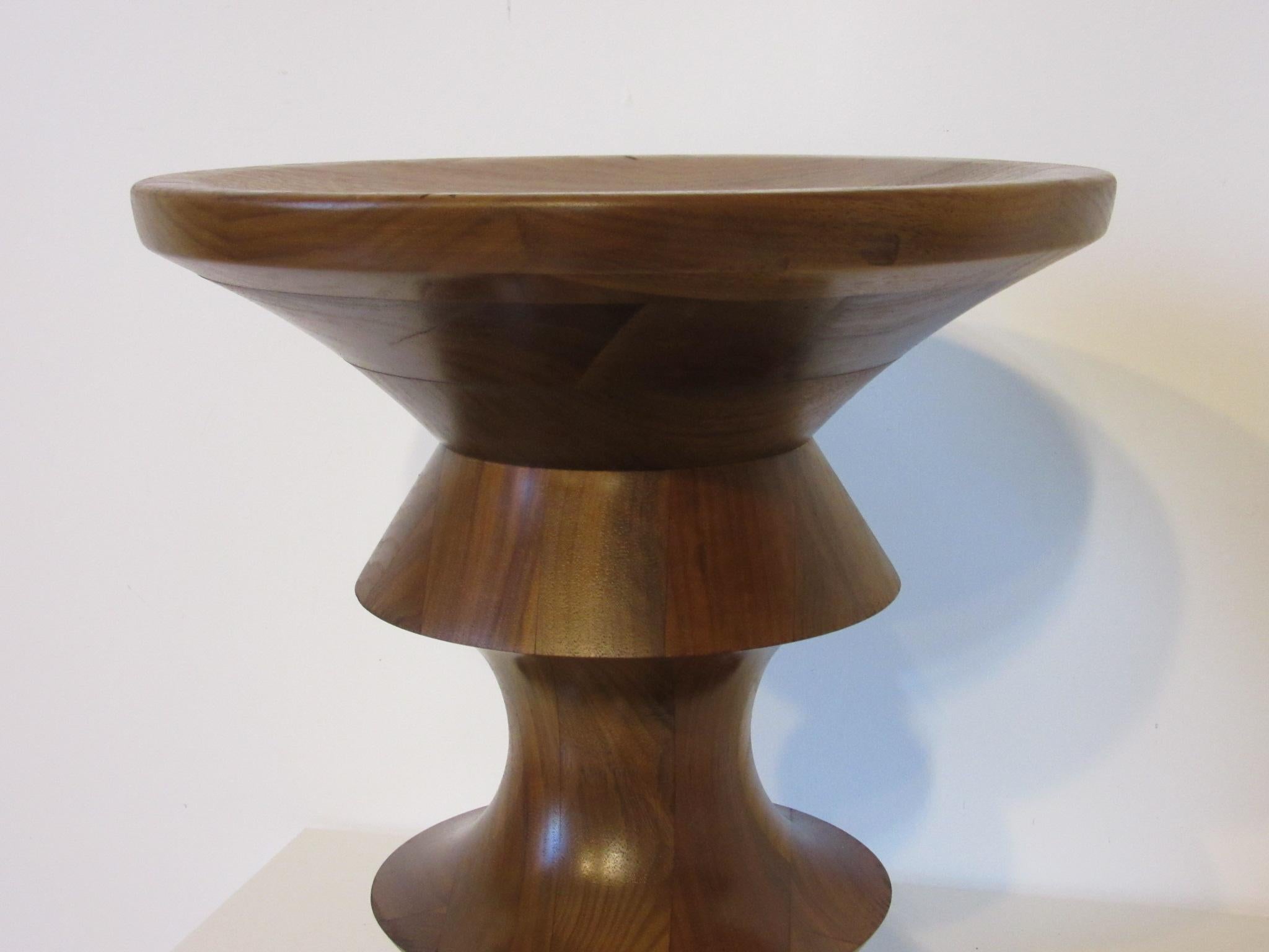 A beautifully grained sculptural American walnut stool or side table model '' A 