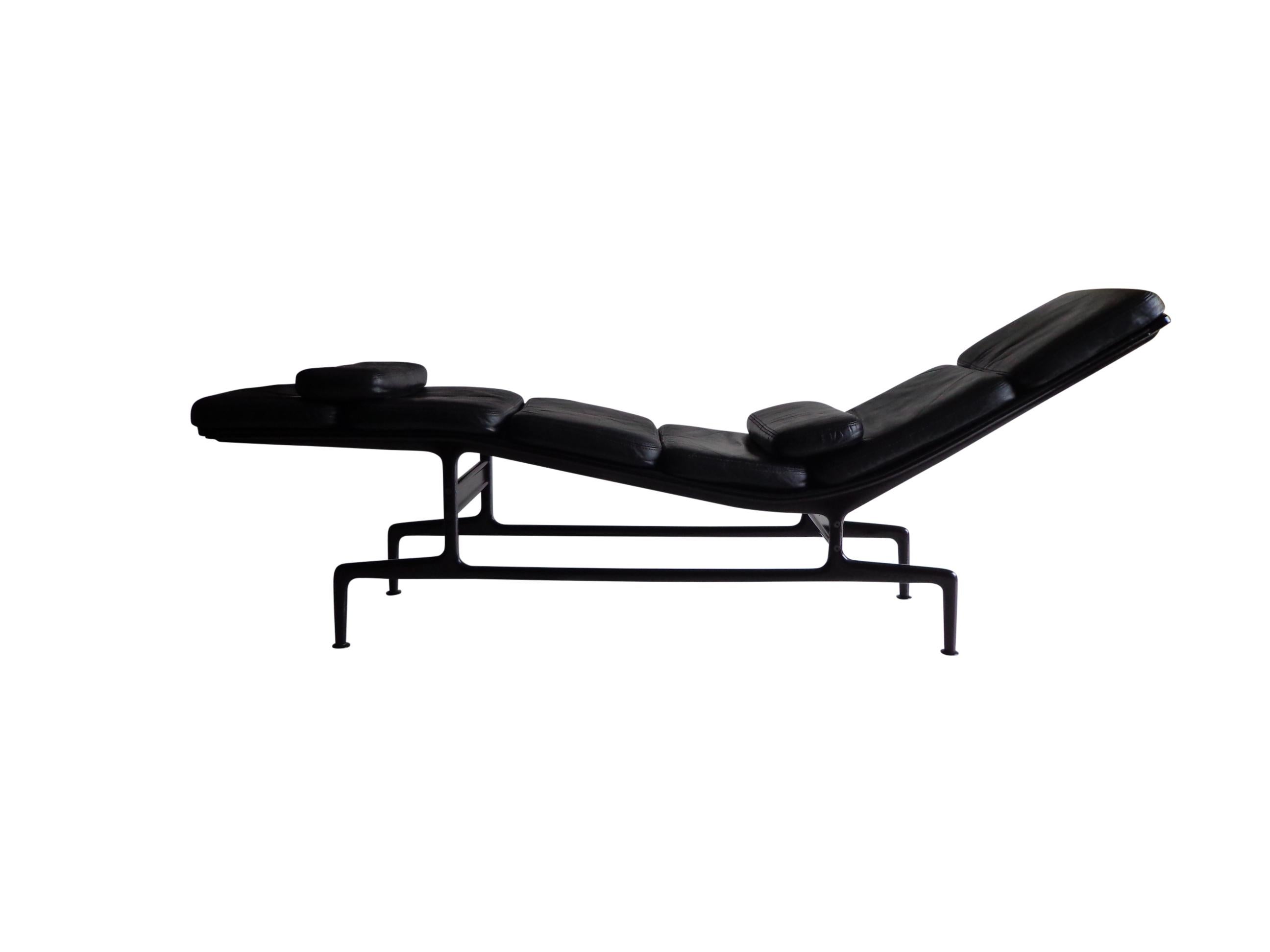 A handsome example of the Billy Wilder chaise lounge by Ray and Charles Eames for Herman Miller. In softpad and high-quality black leather on a eggplant color base. Six cushions connected by zippers are attached to the aluminum frame. Comes with